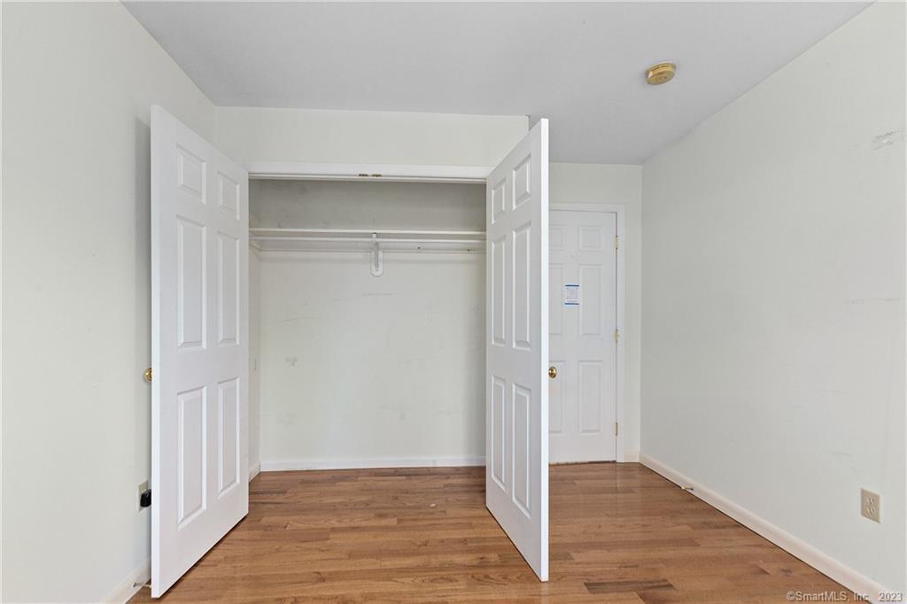 2 Walker Court Greenwich, CT 06831 - Photo 22 of 39 a view of hallway with wooden floor
