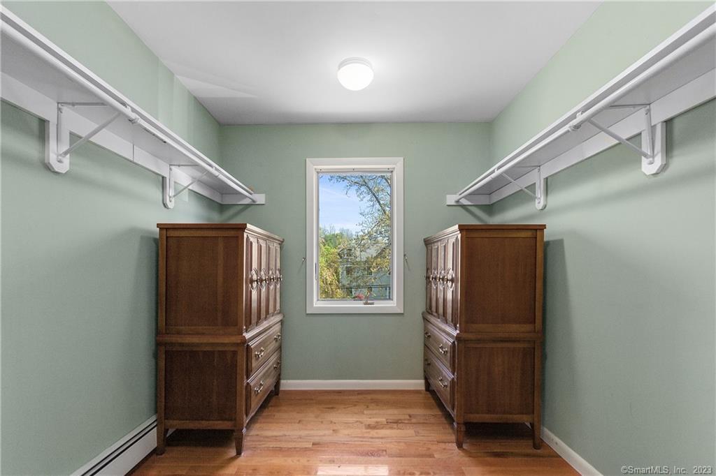 2 Walker Court Greenwich, CT 06831 - Photo 25 of 39 a view of walk in closet with window