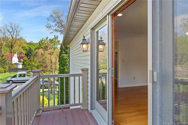 a view of entryway with wooden floor and stairs