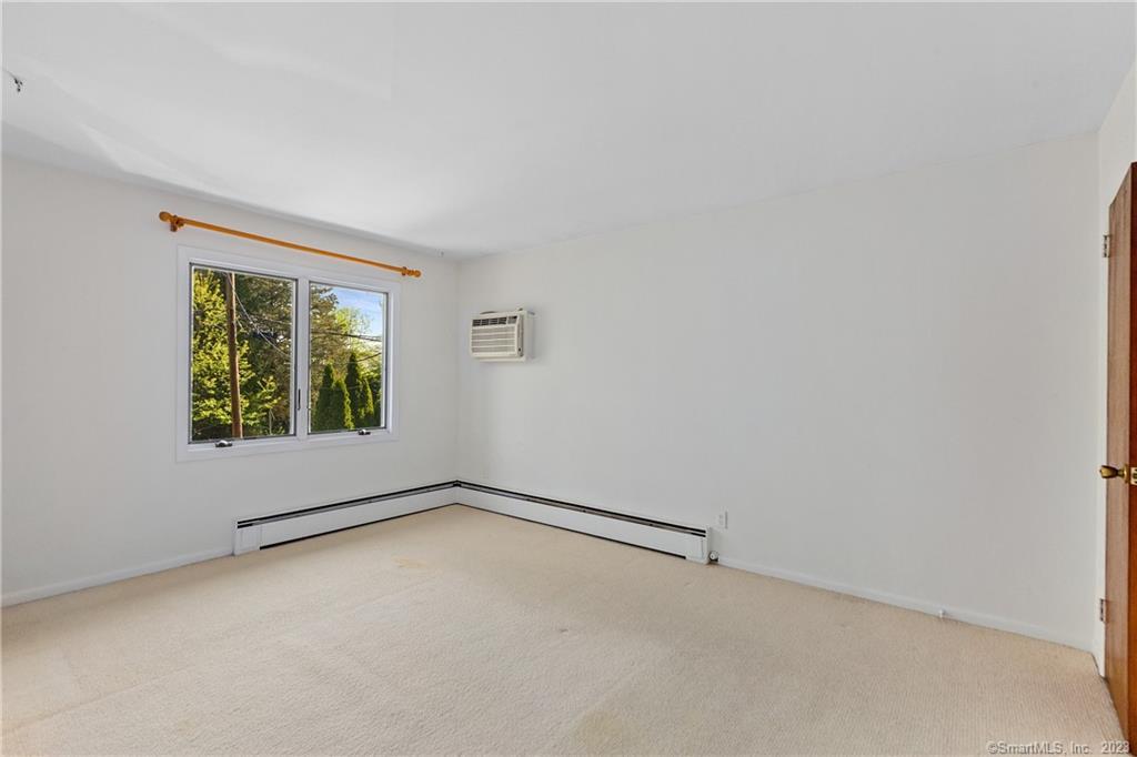 2 Walker Court Greenwich, CT 06831 - Photo 10 of 39 a view of an empty room with a window