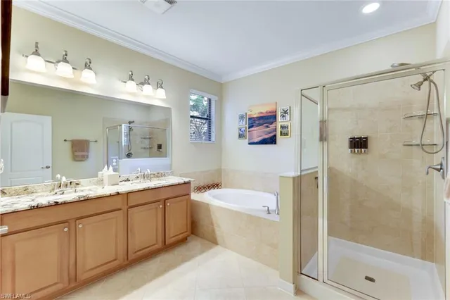 a bathroom with a double vanity sink mirror and shower