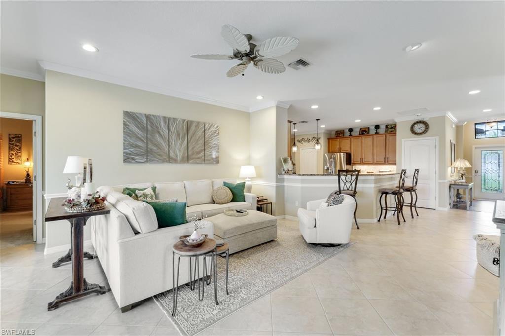 3917 Sapphire Way Naples, FL 34114 - Photo 2 of 44 a living room with furniture and white walls