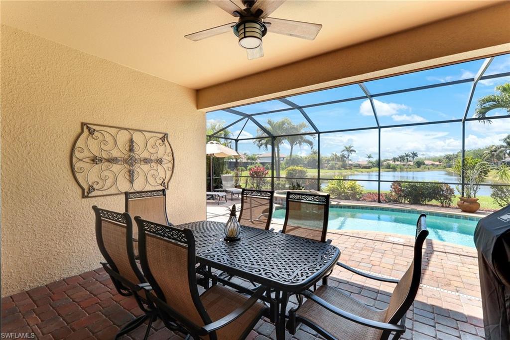 3917 Sapphire Way Naples, FL 34114 - Photo 25 of 44 a dining room with furniture garden view and wooden floor