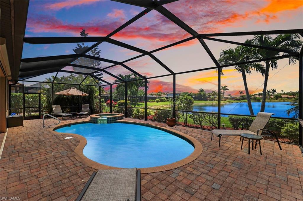 3917 Sapphire Way Naples, FL 34114 - Photo 31 of 44 a view of a swimming pool with a porch