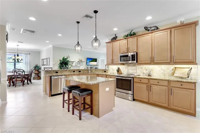 a kitchen with counter top space appliances and cabinets