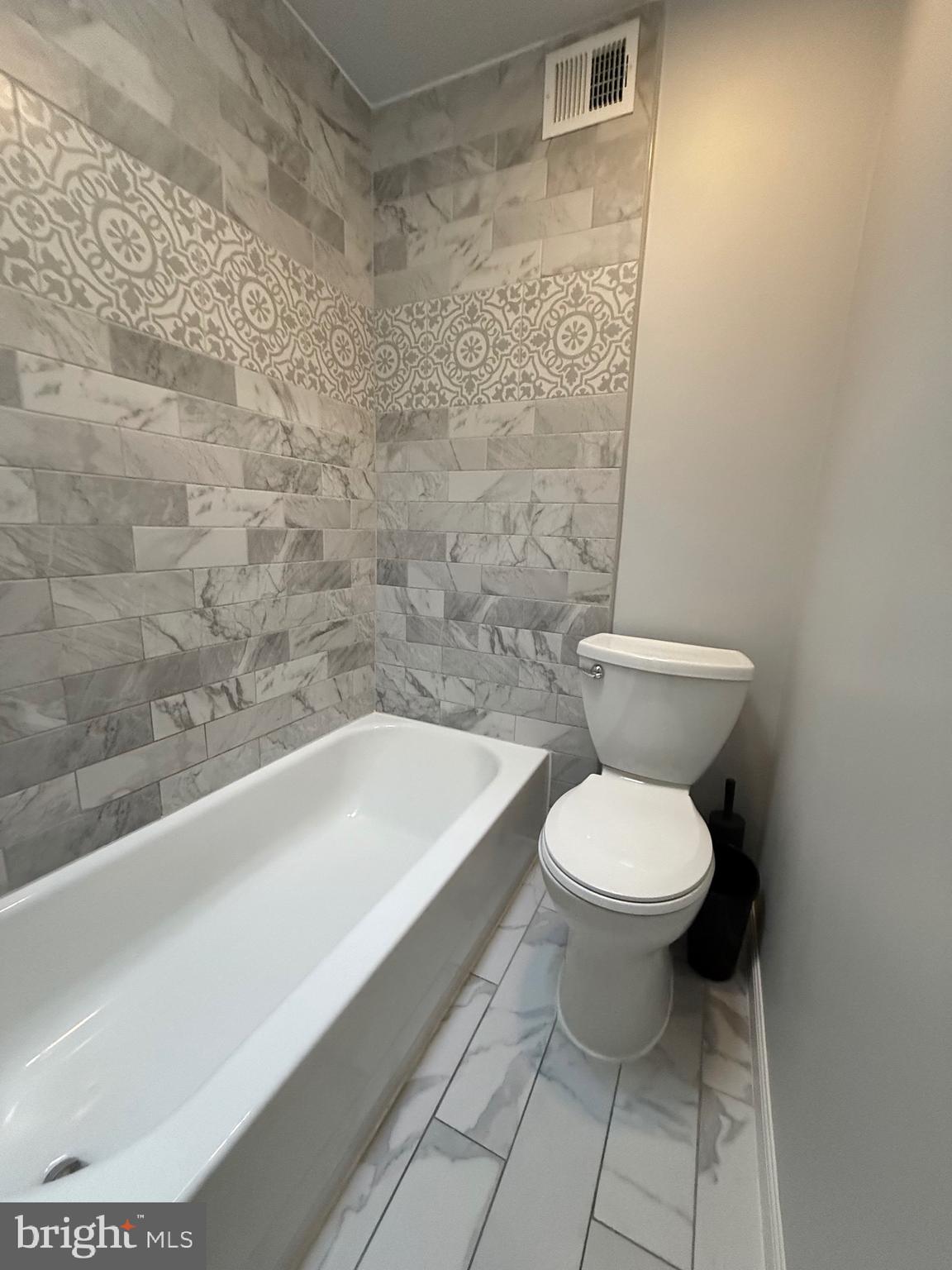 3146 Mercer Street Philadelphia, PA 19134 - Photo 13 of 22 a bathroom with a toilet and a bathtub
