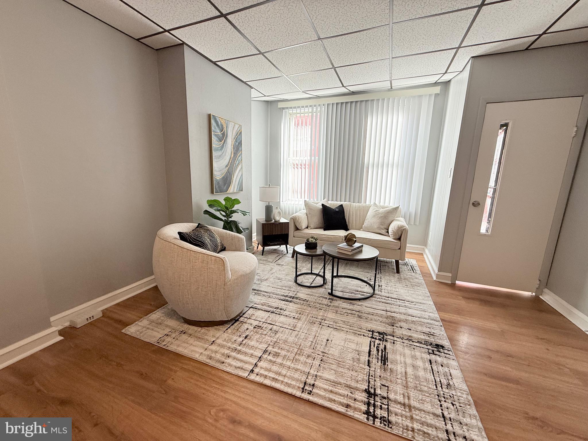 3146 Mercer Street Philadelphia, PA 19134 - Photo 5 of 22 a living room with furniture and a window