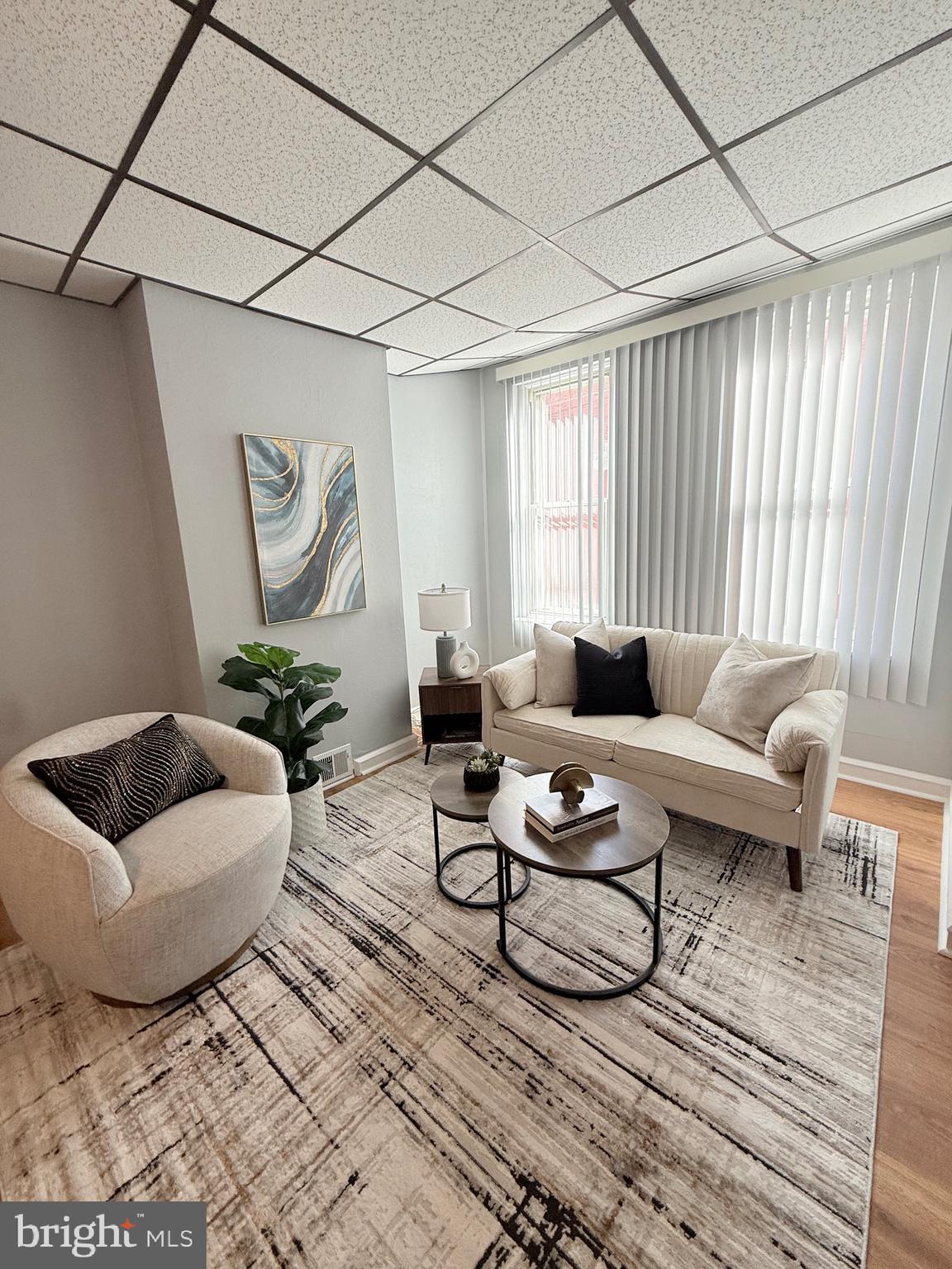 3146 Mercer Street Philadelphia, PA 19134 - Photo 7 of 22 a living room with furniture a rug and a window