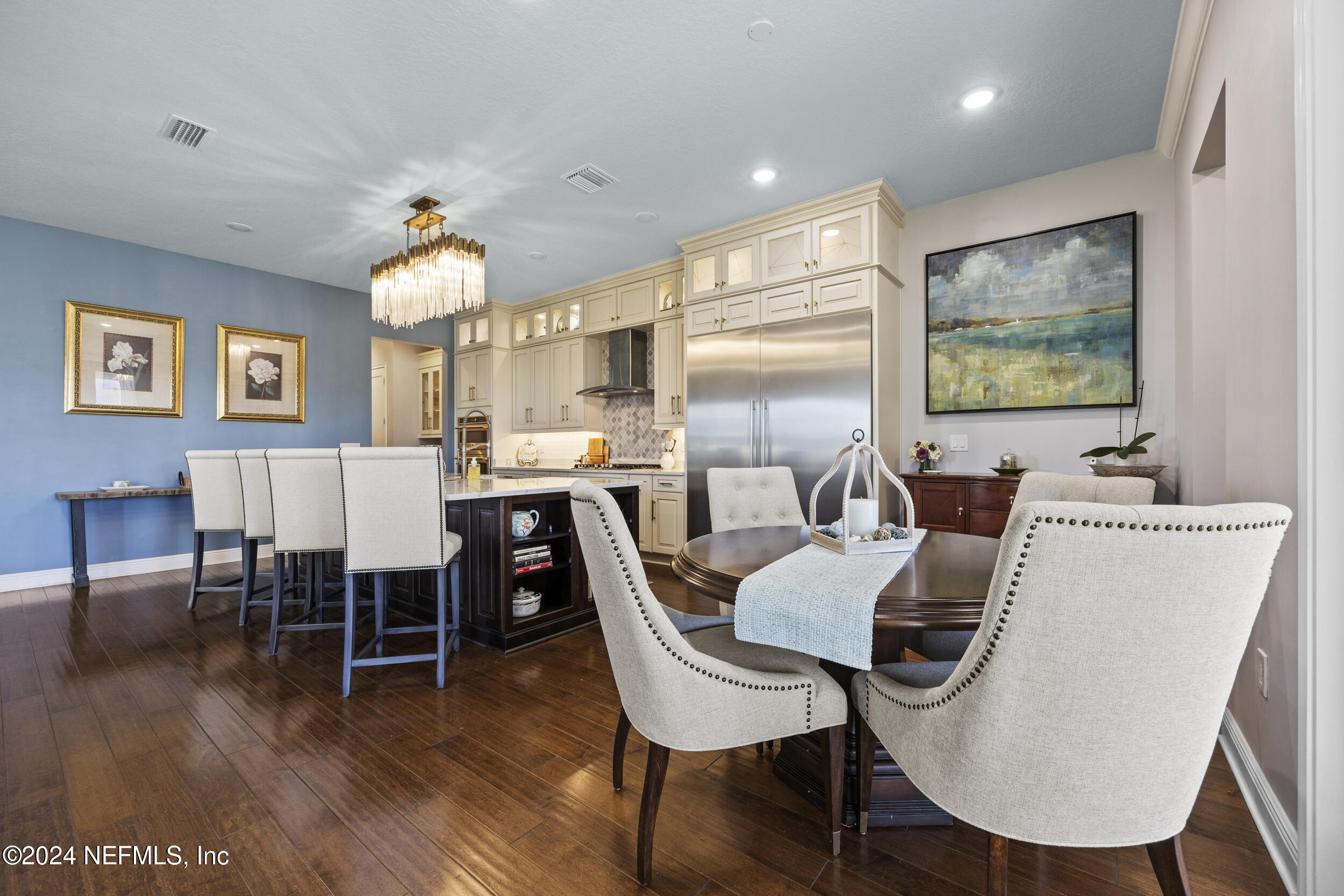 228 Rum Runner Way St. Johns, FL 32259 - Photo 14 of 97 a view of a dining room with furniture window and wooden floor