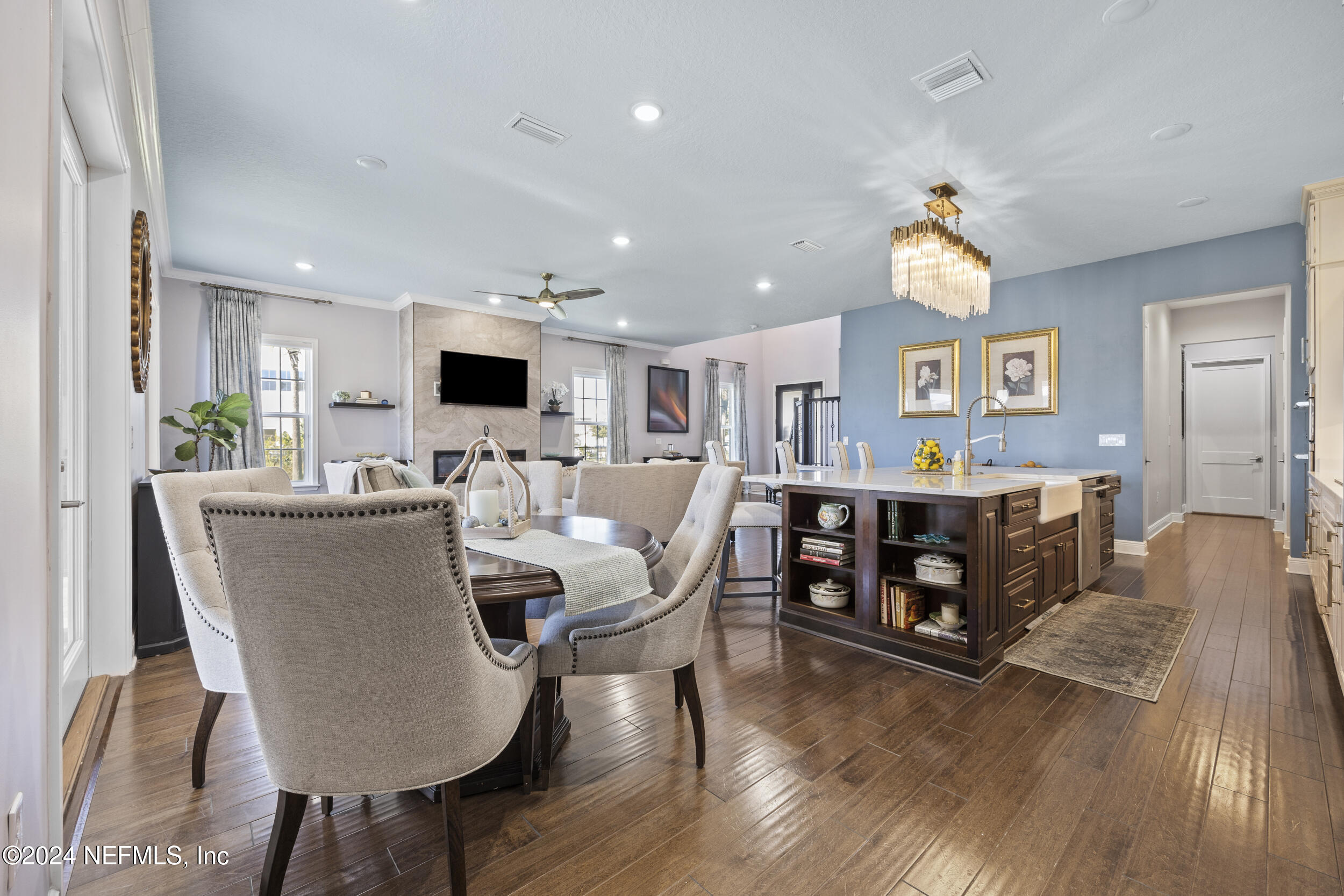 228 Rum Runner Way St. Johns, FL 32259 - Photo 17 of 97 a living room with furniture a flat screen tv and kitchen view