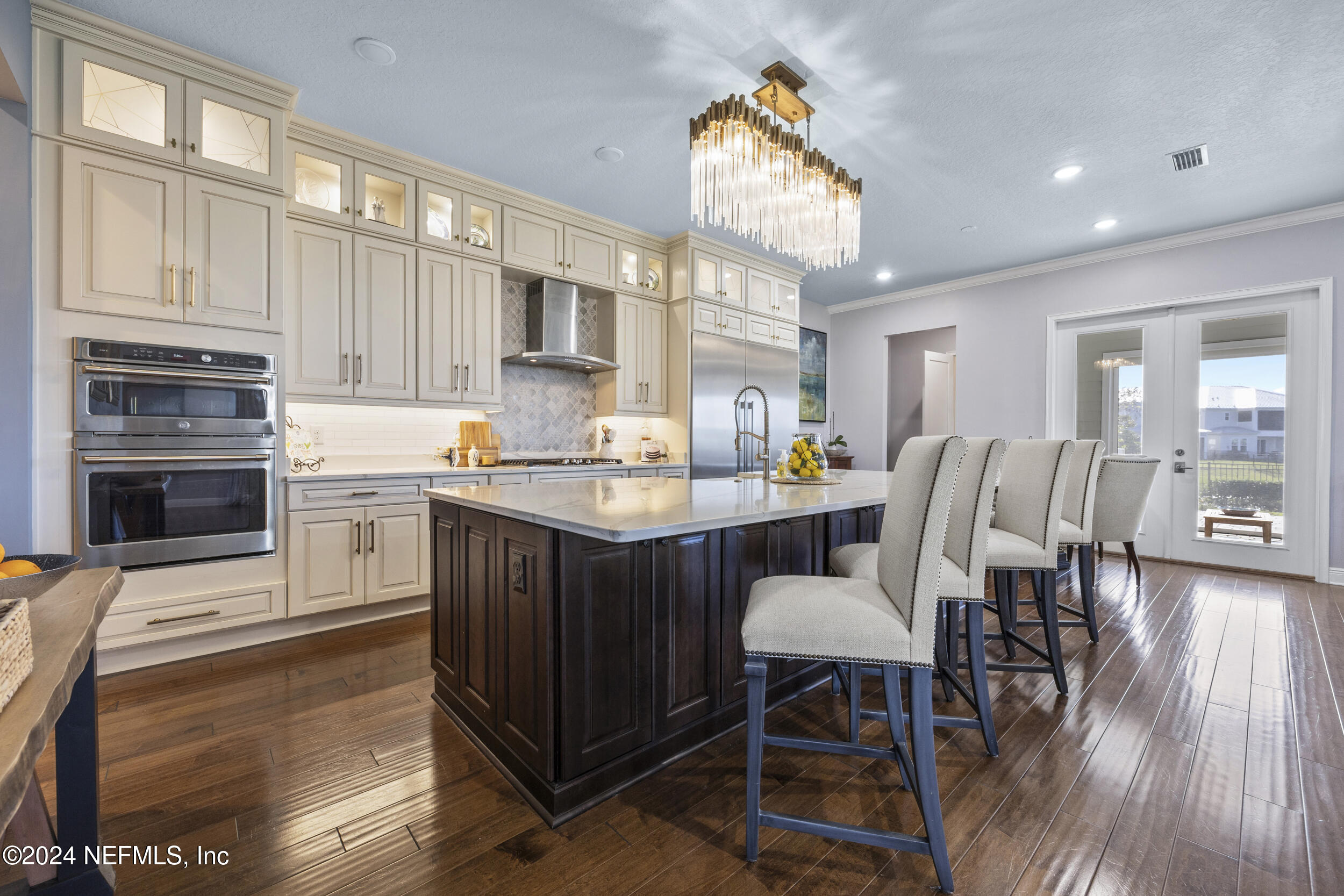 228 Rum Runner Way St. Johns, FL 32259 - Photo 20 of 97 a kitchen with a table chairs sink and cabinets