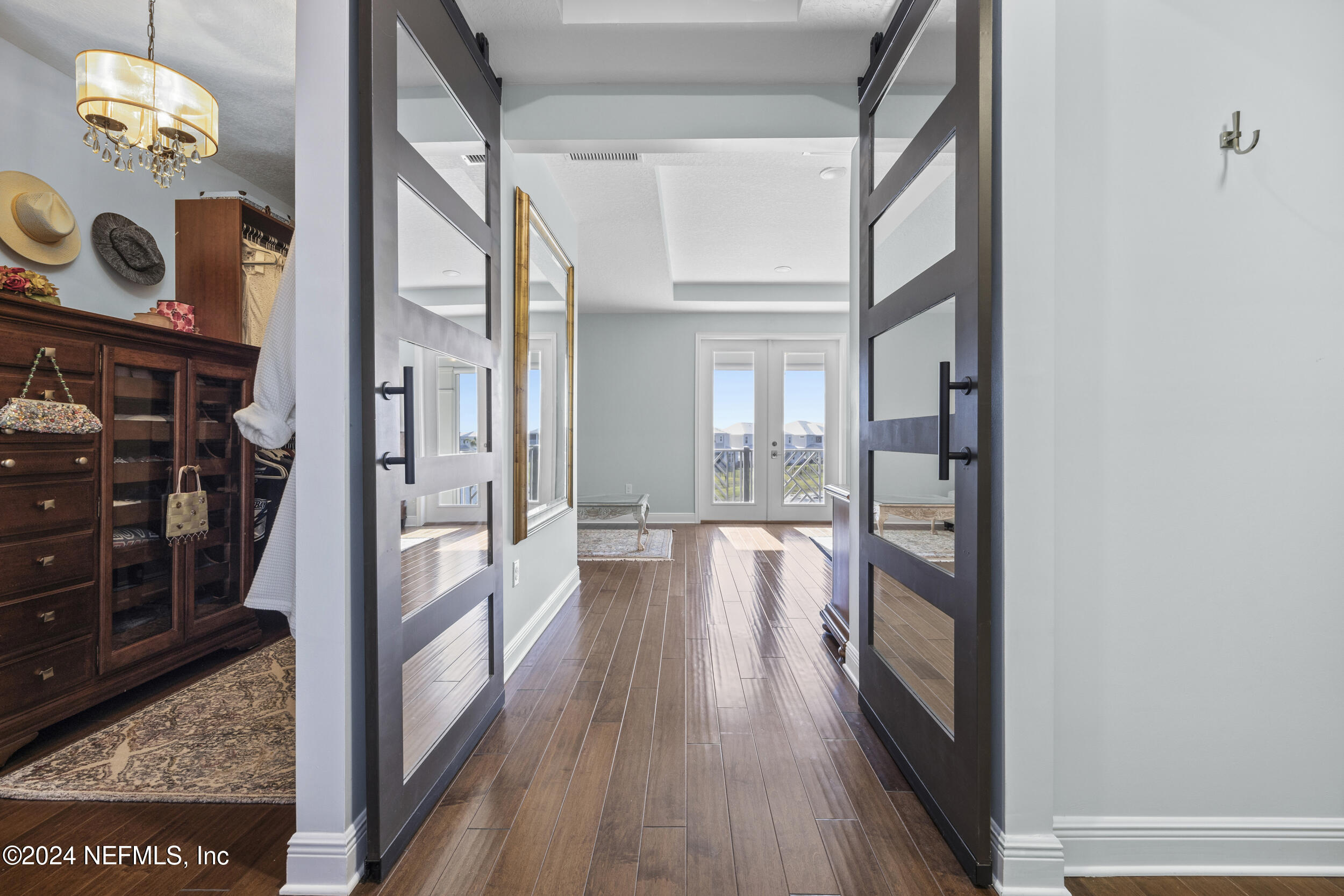 228 Rum Runner Way St. Johns, FL 32259 - Photo 32 of 97 a view of hallway with livingroom and wooden floor