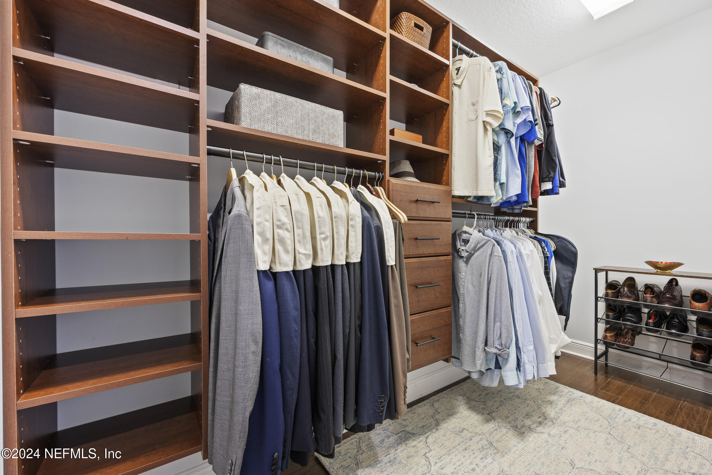 228 Rum Runner Way St. Johns, FL 32259 - Photo 34 of 97 a view of walk in closet with clothes and shoes