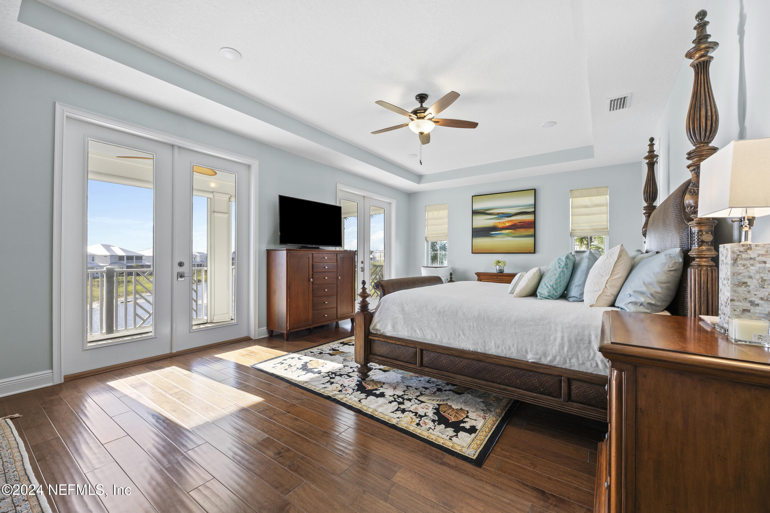 228 Rum Runner Way St. Johns, FL 32259 - Photo 35 of 97 a bed room with a bed window and a flat screen tv