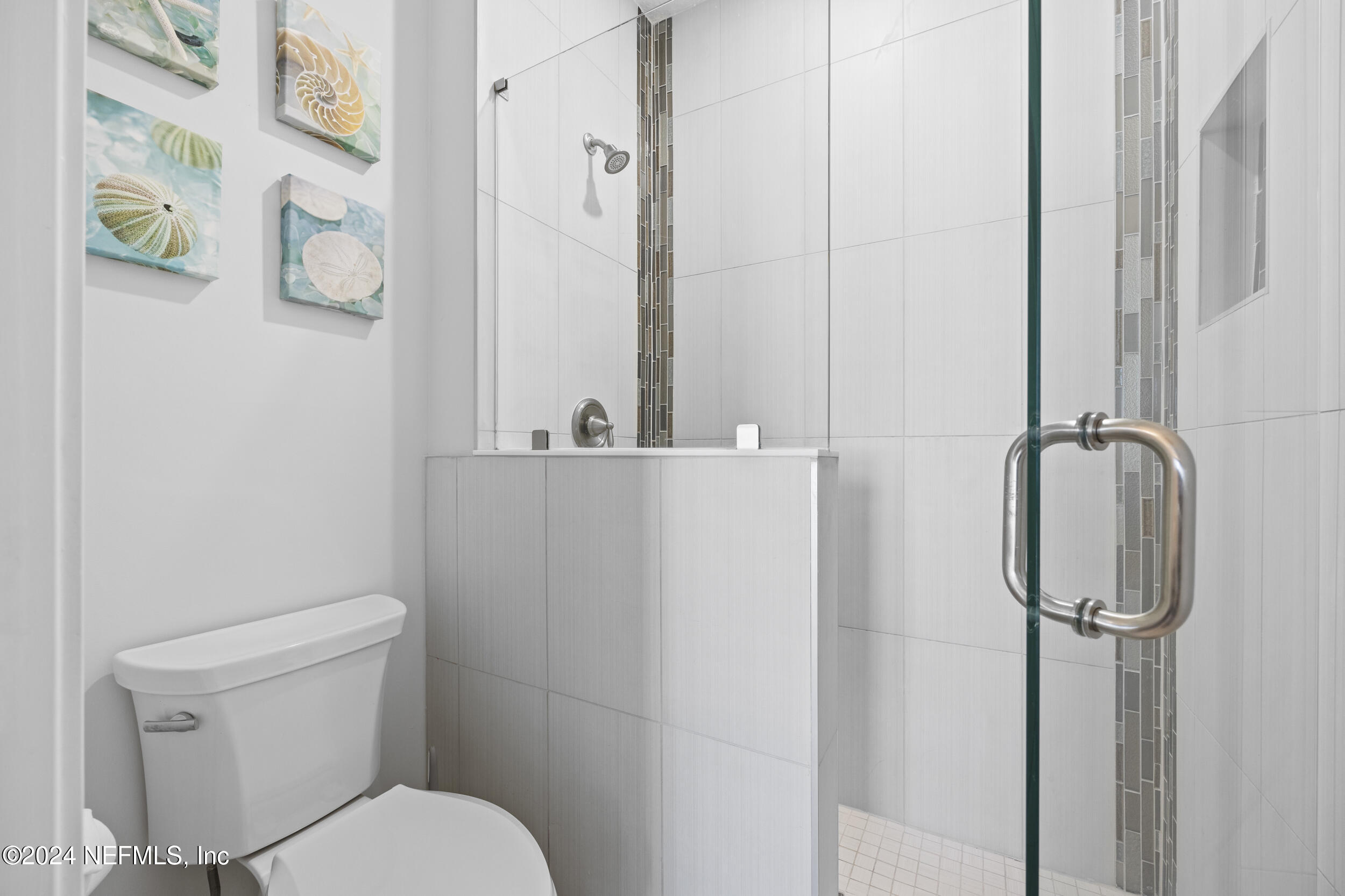 228 Rum Runner Way St. Johns, FL 32259 - Photo 51 of 97 a white toilet sitting next to a bathroom sink