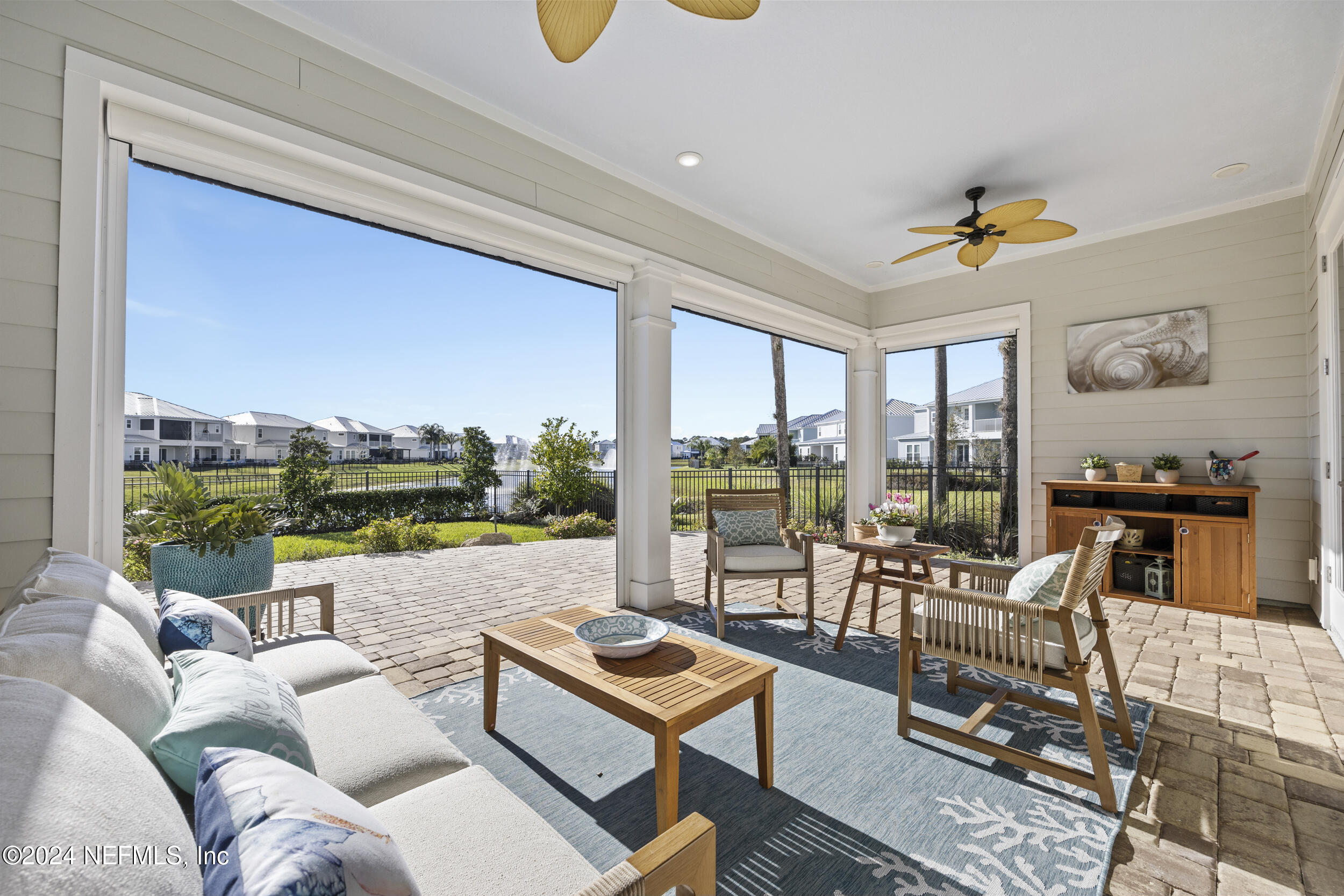 228 Rum Runner Way St. Johns, FL 32259 - Photo 59 of 97 a living room with furniture and a floor to ceiling window