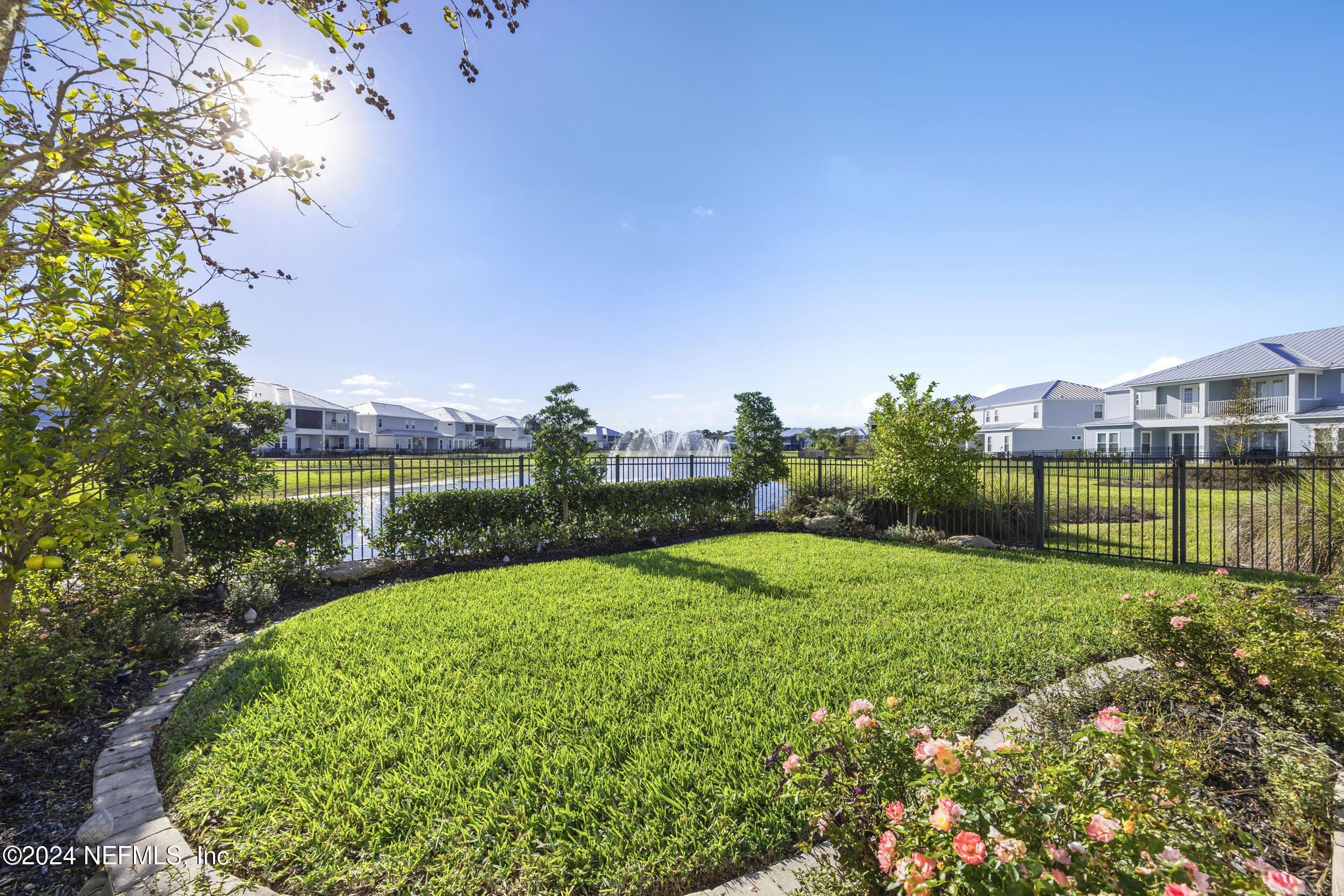 228 Rum Runner Way St. Johns, FL 32259 - Photo 60 of 97 a view of a garden with a building in the background