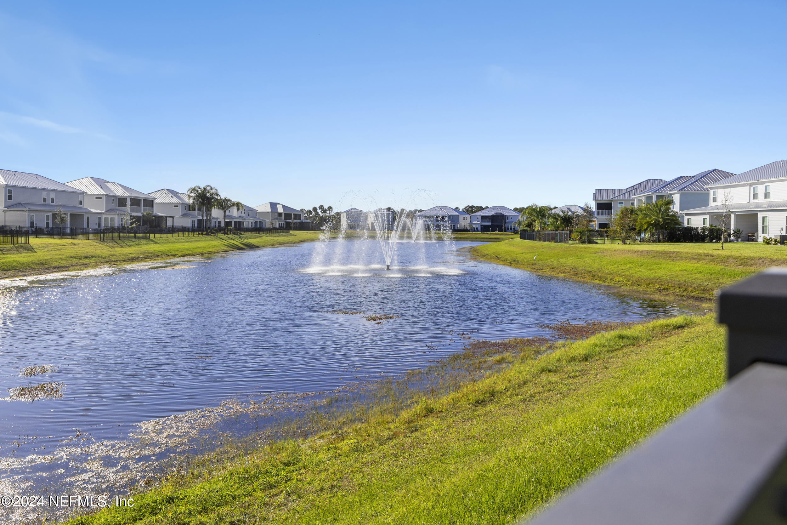 228 Rum Runner Way St. Johns, FL 32259 - Photo 61 of 97 a view of a lake with houses in the back