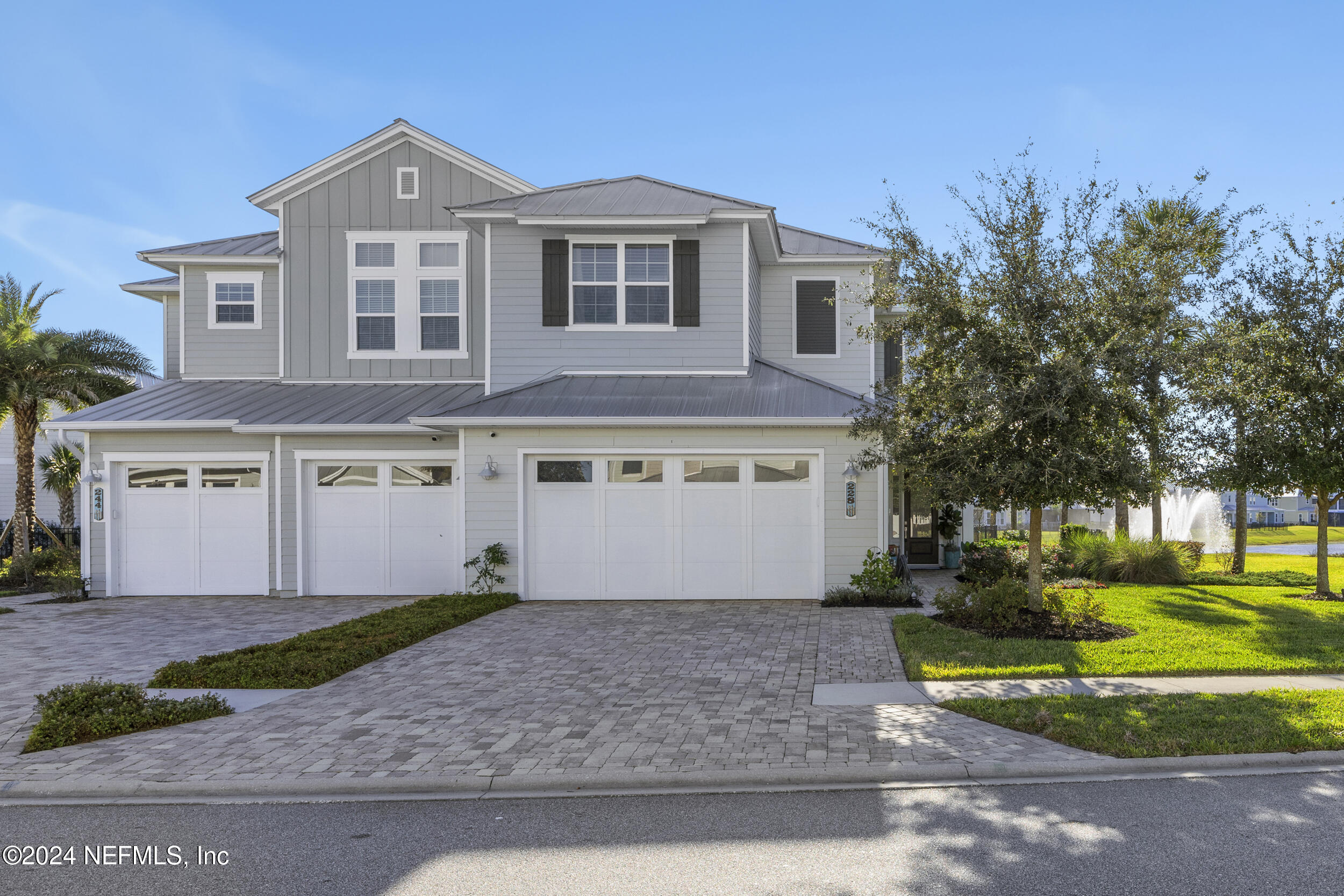 228 Rum Runner Way St. Johns, FL 32259 - Photo 70 of 97 a front view of a house with a yard and garage