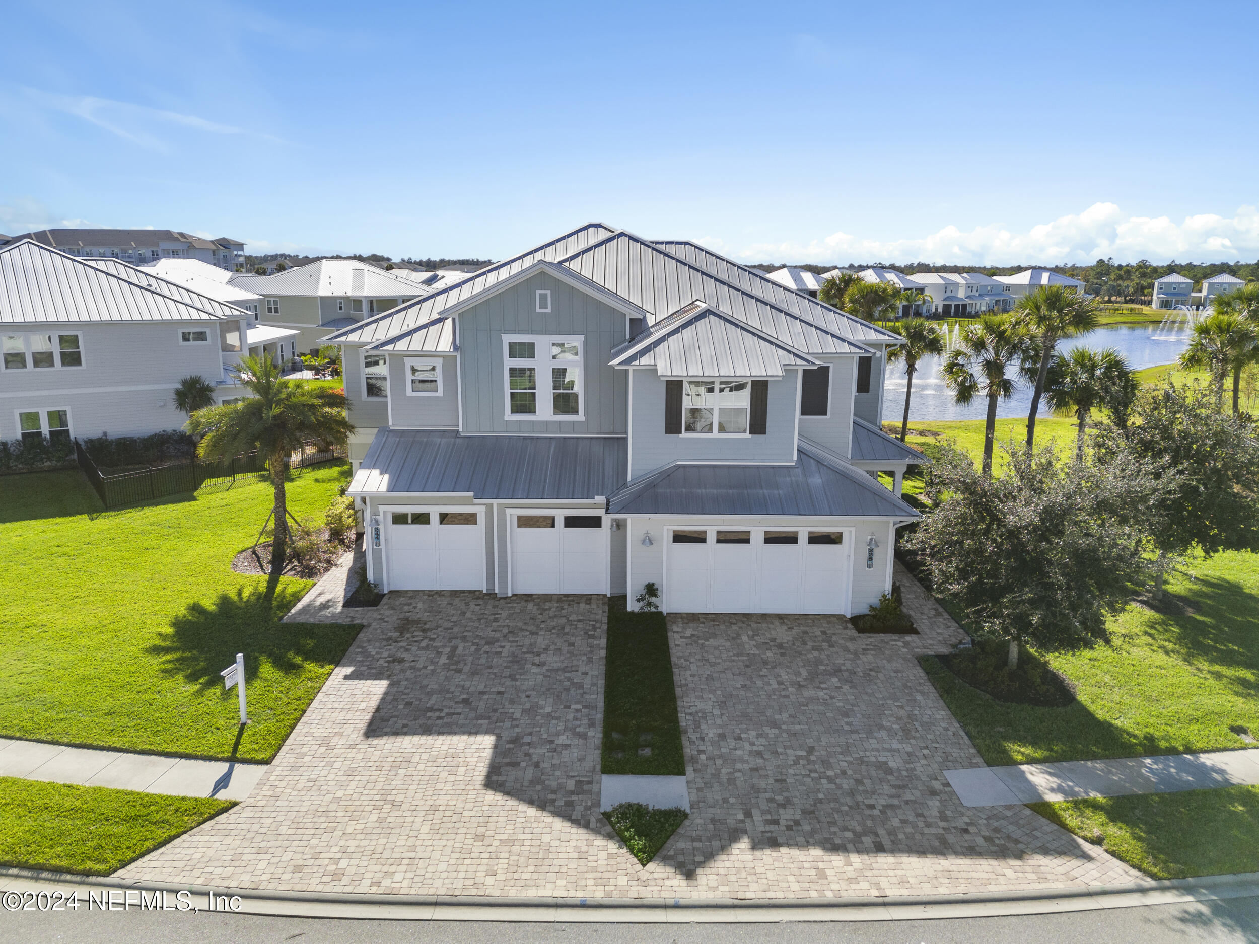 228 Rum Runner Way St. Johns, FL 32259 - Photo 71 of 97 a front view of a house with a yard and potted plants