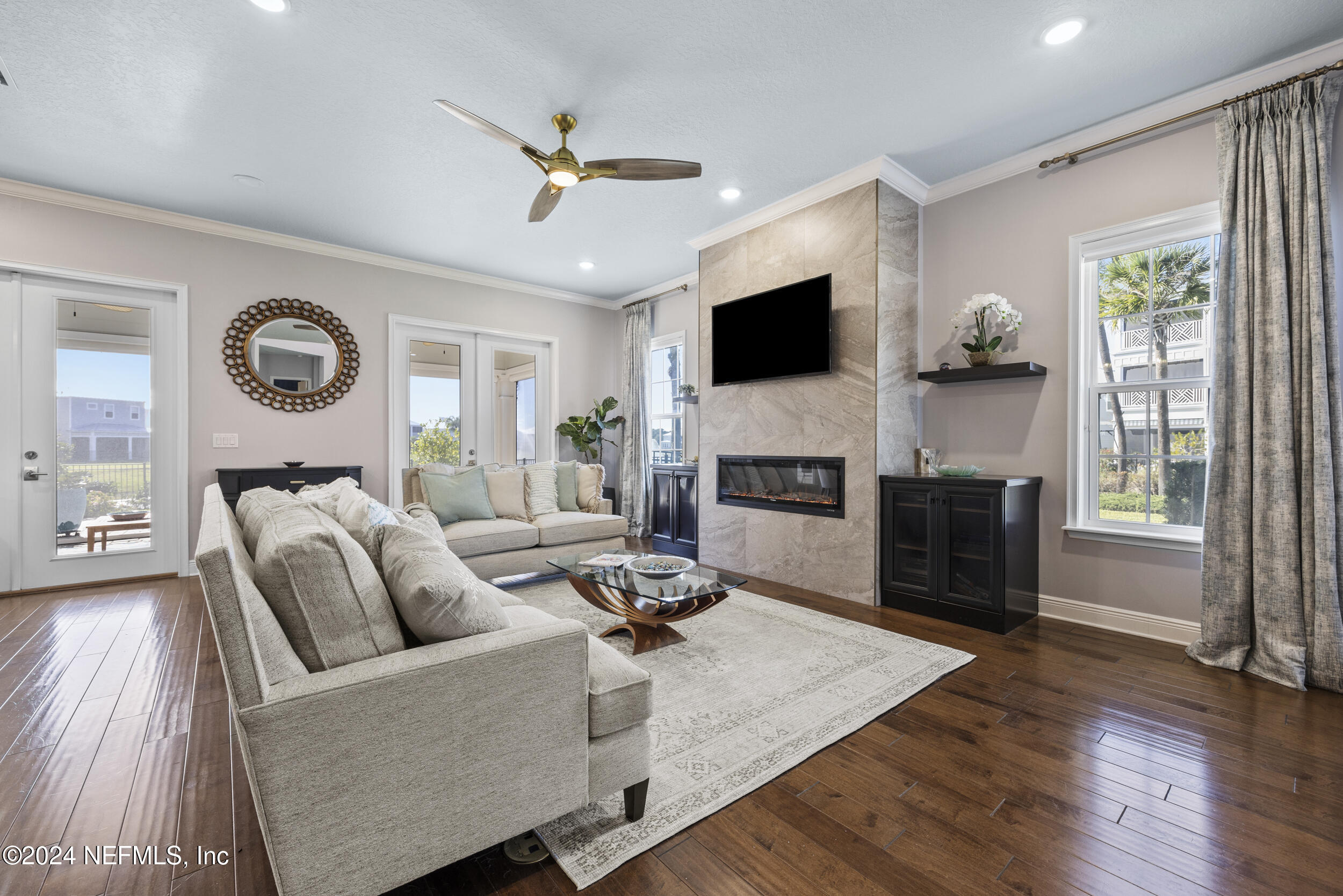 228 Rum Runner Way St. Johns, FL 32259 - Photo 10 of 97 a living room with furniture and a flat screen tv