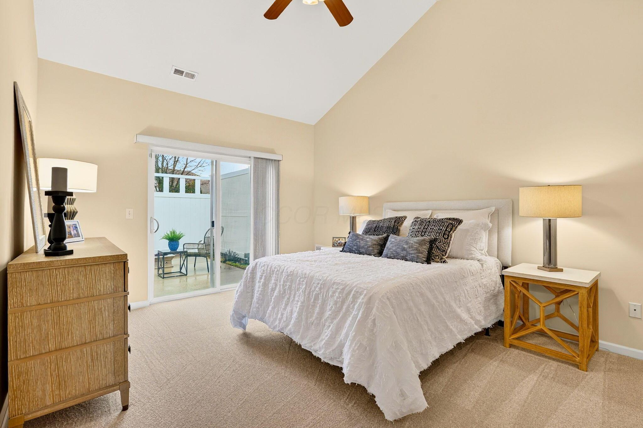 6931 Rothwell Street New Albany, OH 43054 - Photo 29 of 58 Vaulted ceiling with lighted fan & patio doors to courtyard
