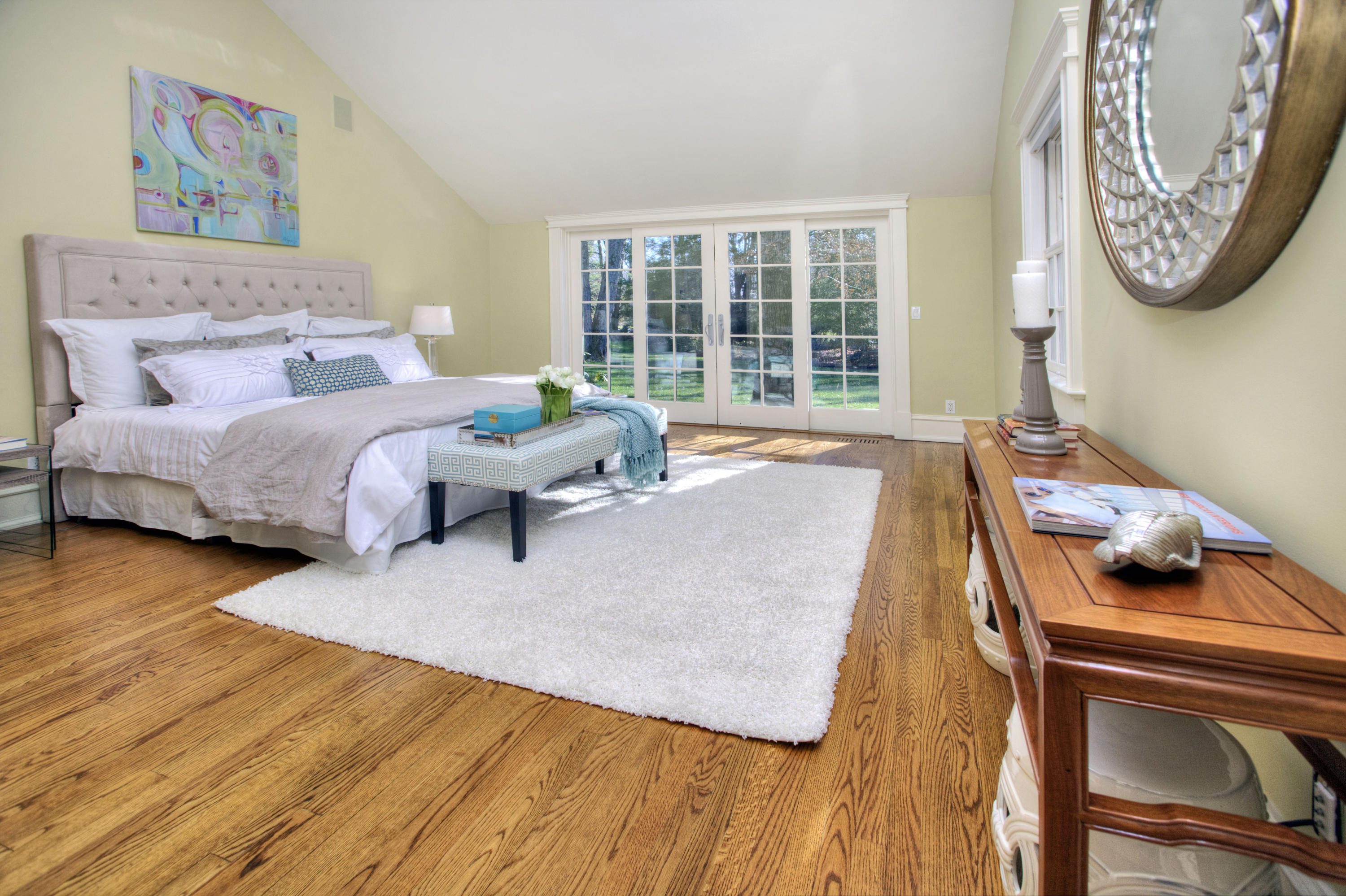 72 Ridge Acres Road Darien, CT 06820 - Photo 14 of 25 a bedroom with a bed and wooden floor