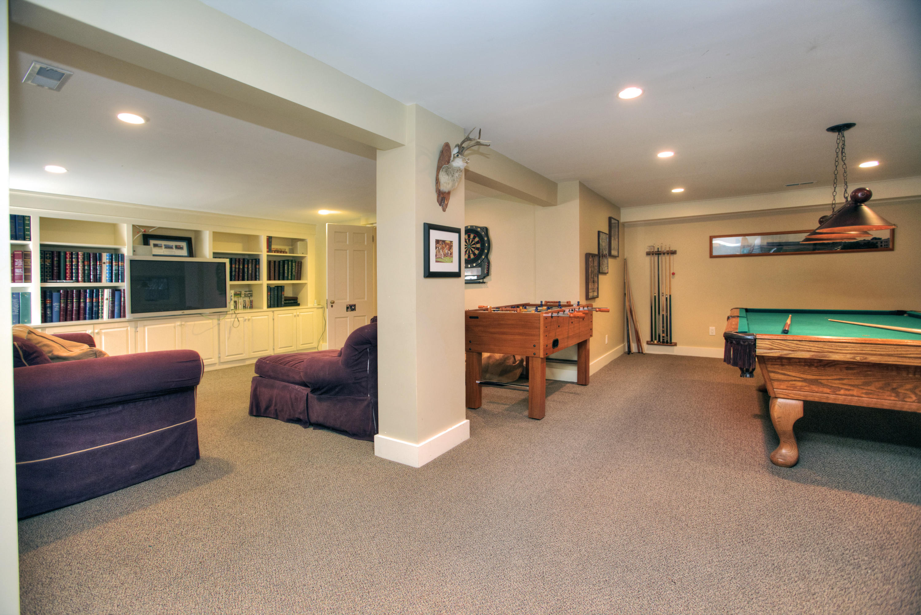 72 Ridge Acres Road Darien, CT 06820 - Photo 20 of 25 a living room with furniture and a flat screen tv