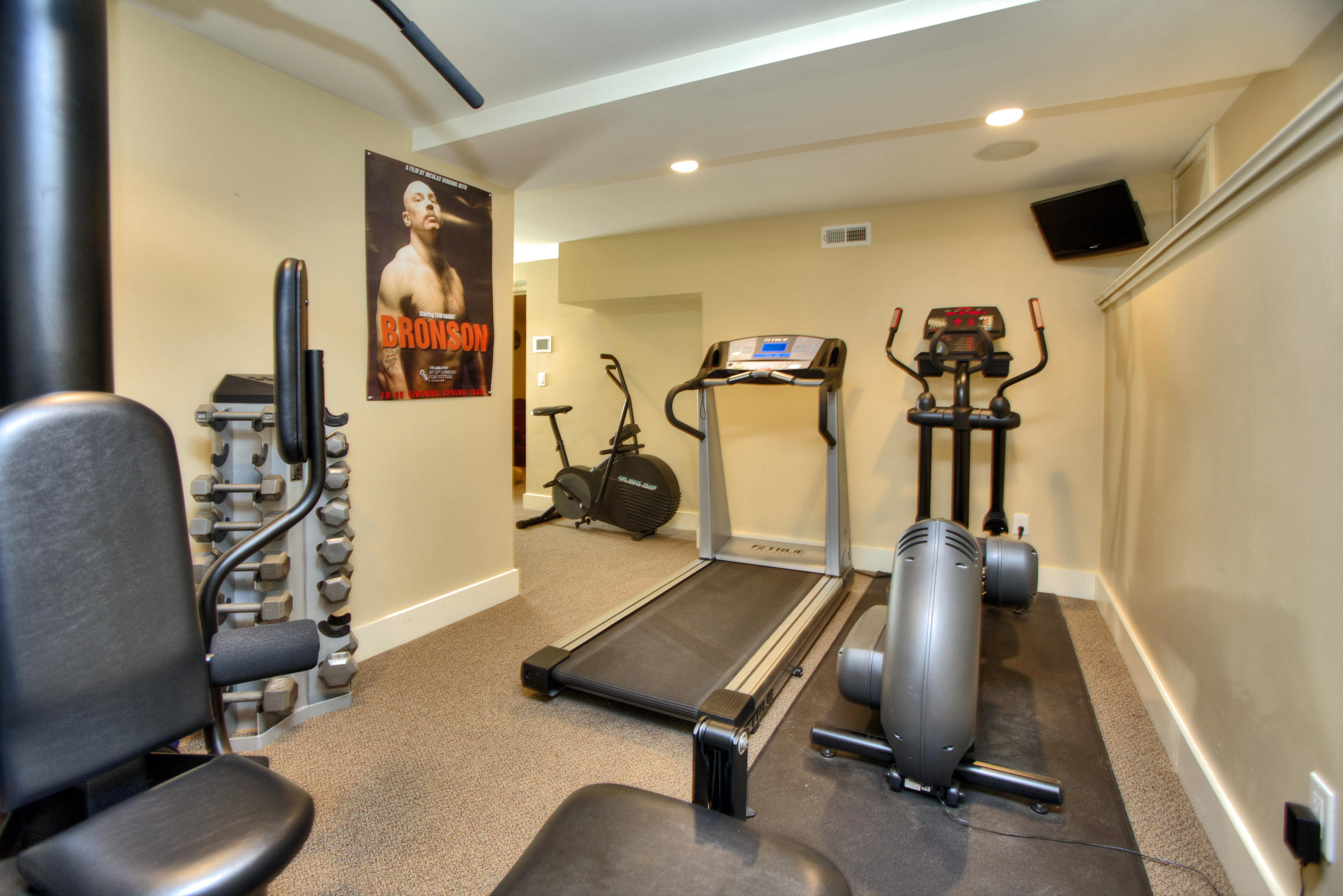 72 Ridge Acres Road Darien, CT 06820 - Photo 21 of 25 a room with gym equipment and windows