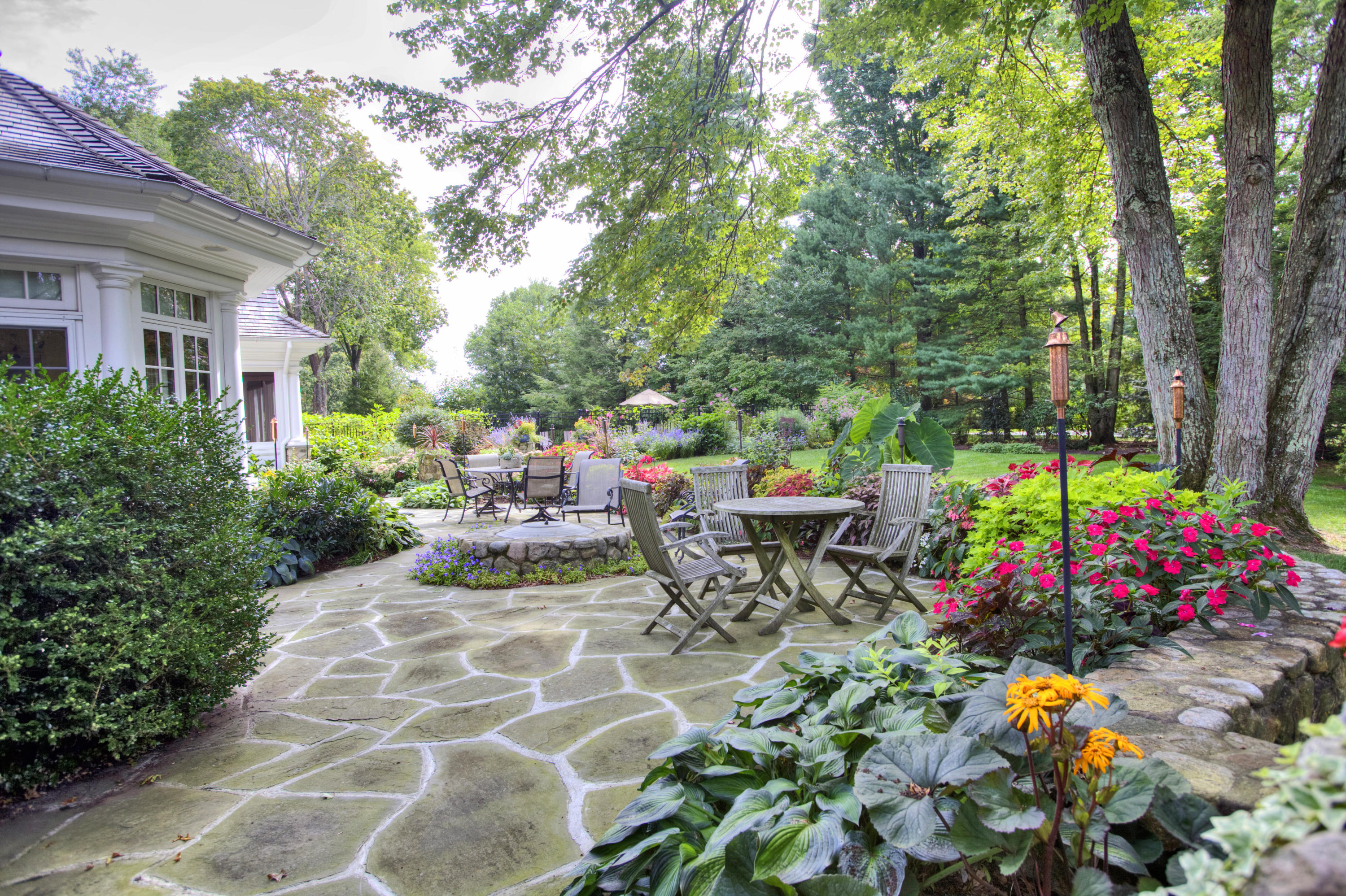 72 Ridge Acres Road Darien, CT 06820 - Photo 22 of 25 a view of a bench in a garden