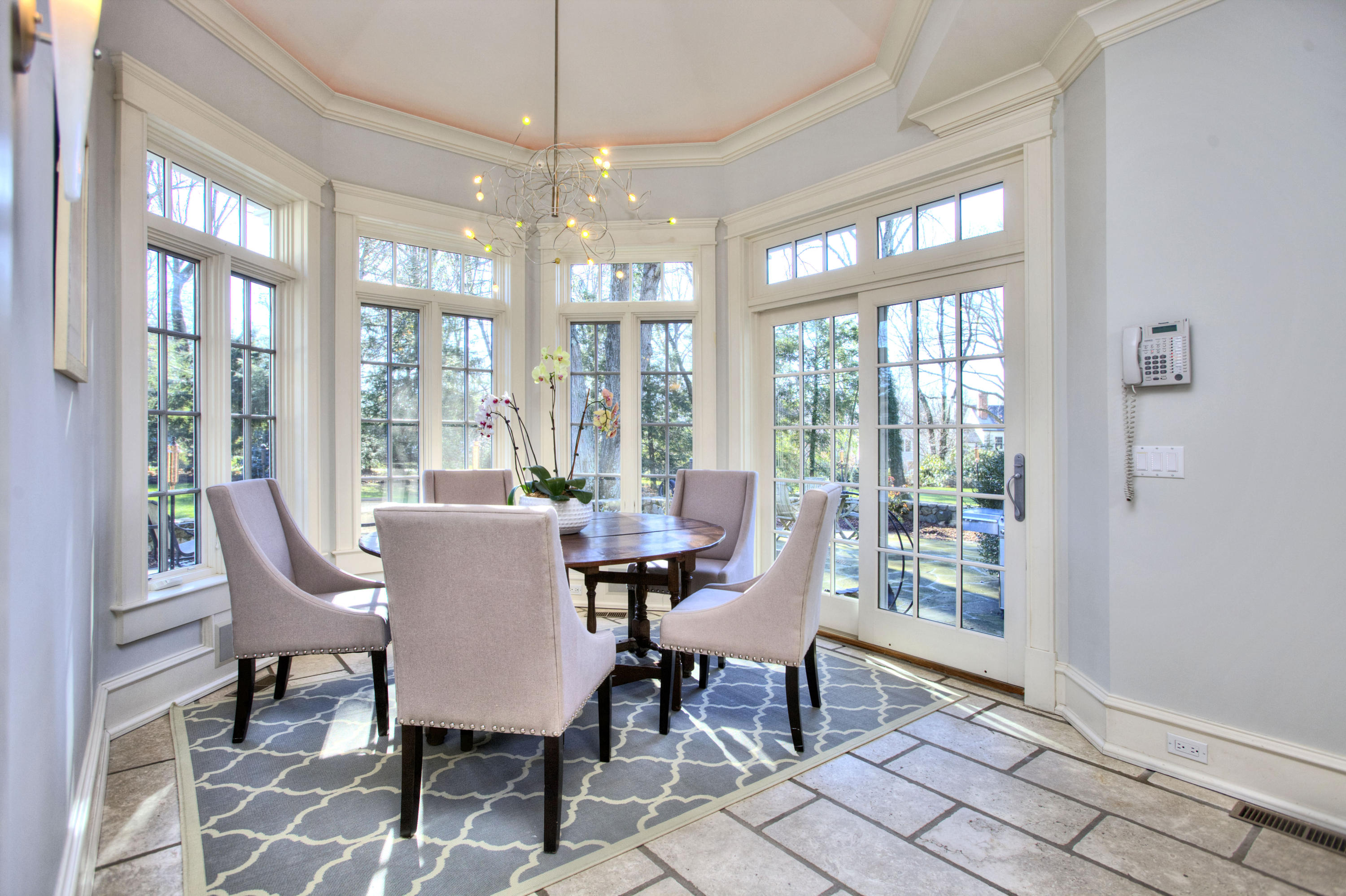 72 Ridge Acres Road Darien, CT 06820 - Photo 9 of 25 a view of a dining room with furniture a chandelier and wooden floor