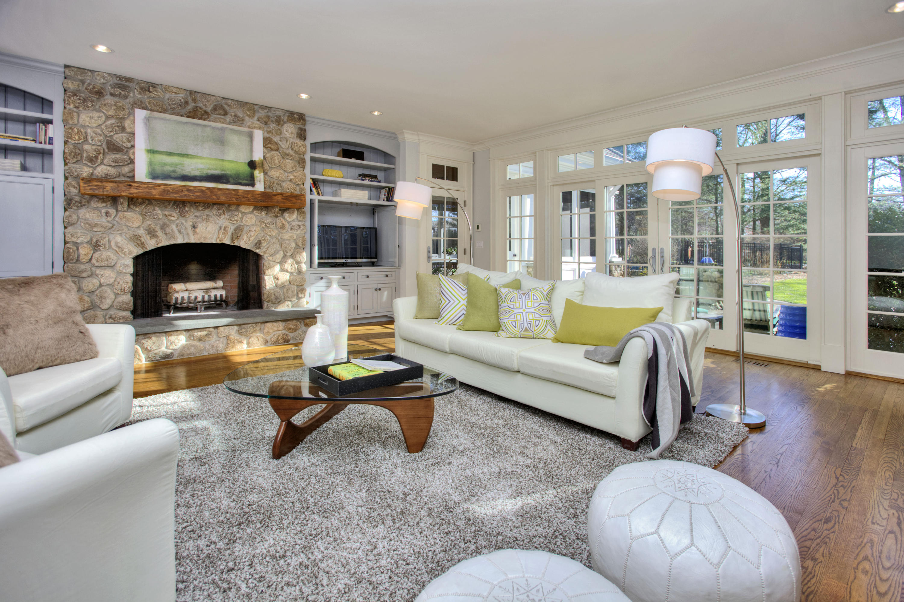 72 Ridge Acres Road Darien, CT 06820 - Photo 10 of 25 a living room with furniture fireplace and a large window