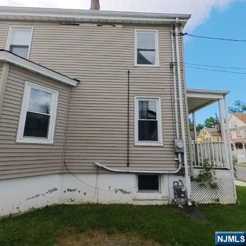 167 James Street Hackensack, NJ 07601 - Photo 4 of 30 a view of a house with a yard and a large window