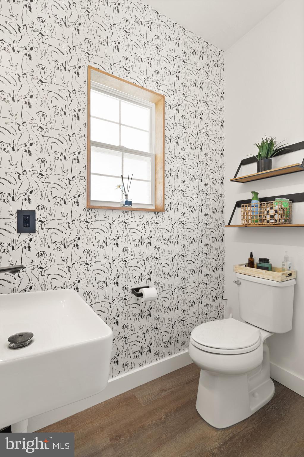 15911 Aerial View Road Woodbridge, VA 22193 - Photo 17 of 48 a white toilet sitting next to a bathroom sink