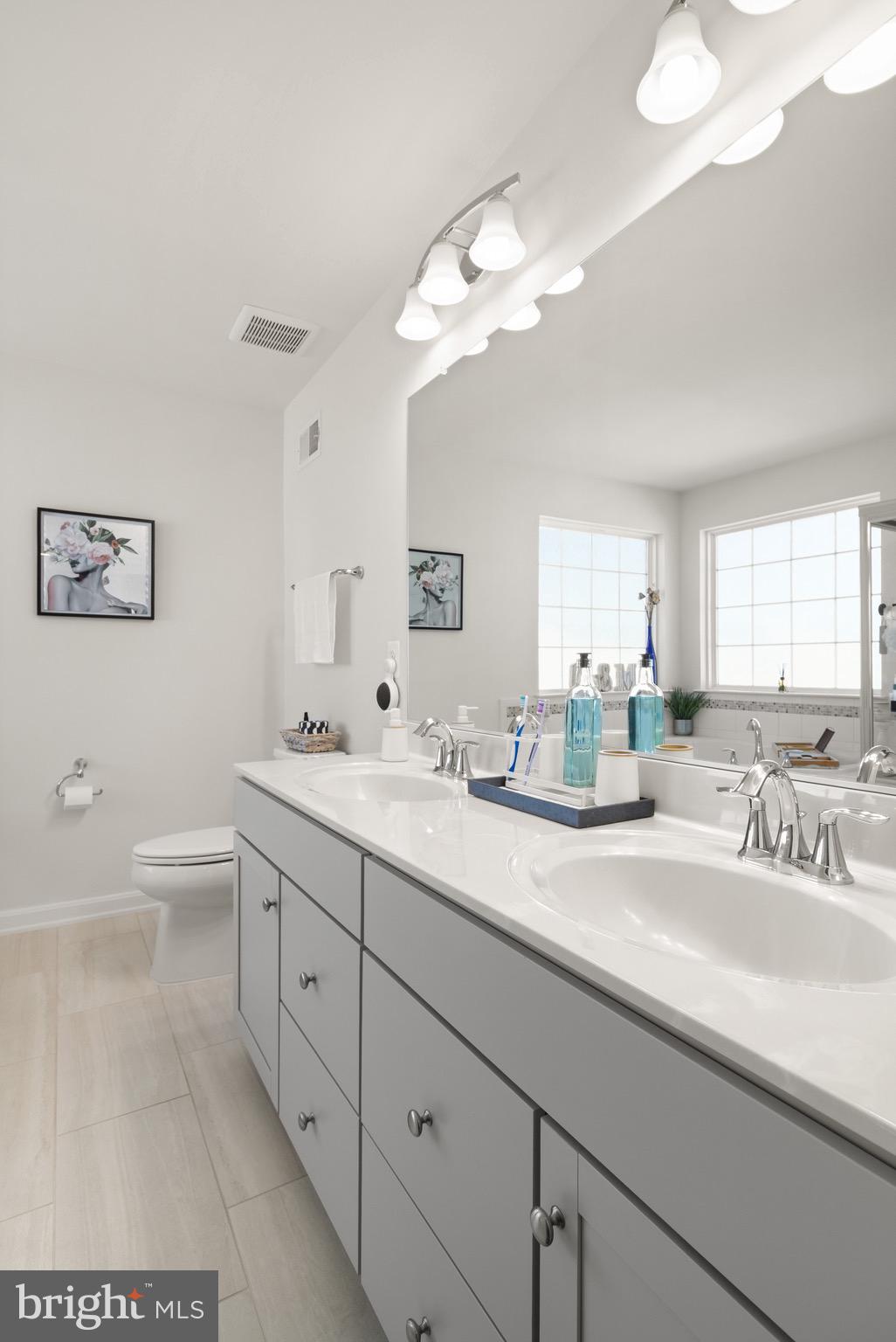 15911 Aerial View Road Woodbridge, VA 22193 - Photo 24 of 48 a bathroom with a double vanity sink and a mirror