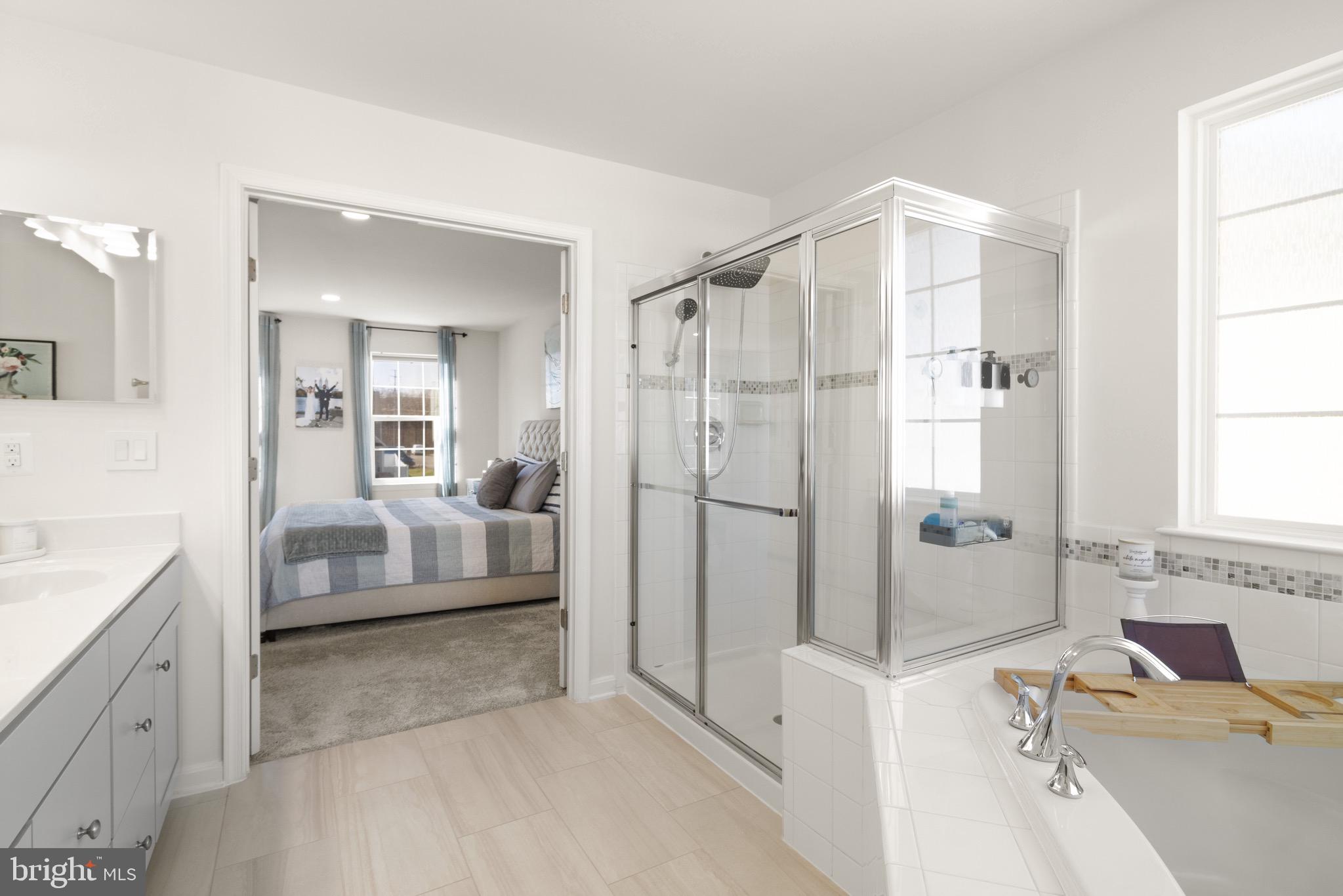 15911 Aerial View Road Woodbridge, VA 22193 - Photo 25 of 48 a spacious bathroom with a tub sink shower and mirror