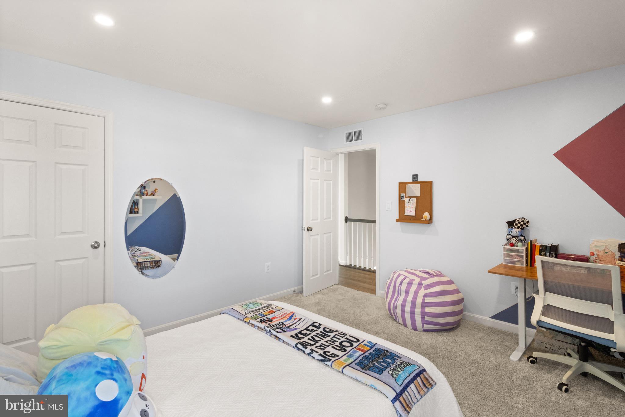 15911 Aerial View Road Woodbridge, VA 22193 - Photo 27 of 48 a bedroom with a bed and a lamp