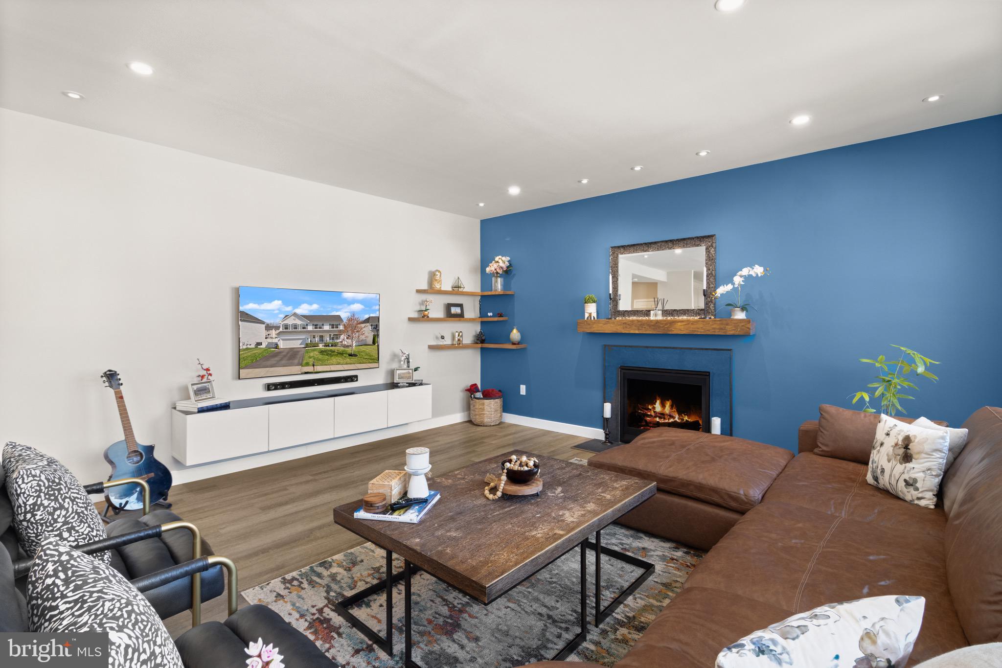 15911 Aerial View Road Woodbridge, VA 22193 - Photo 4 of 48 a living room with furniture and a fireplace