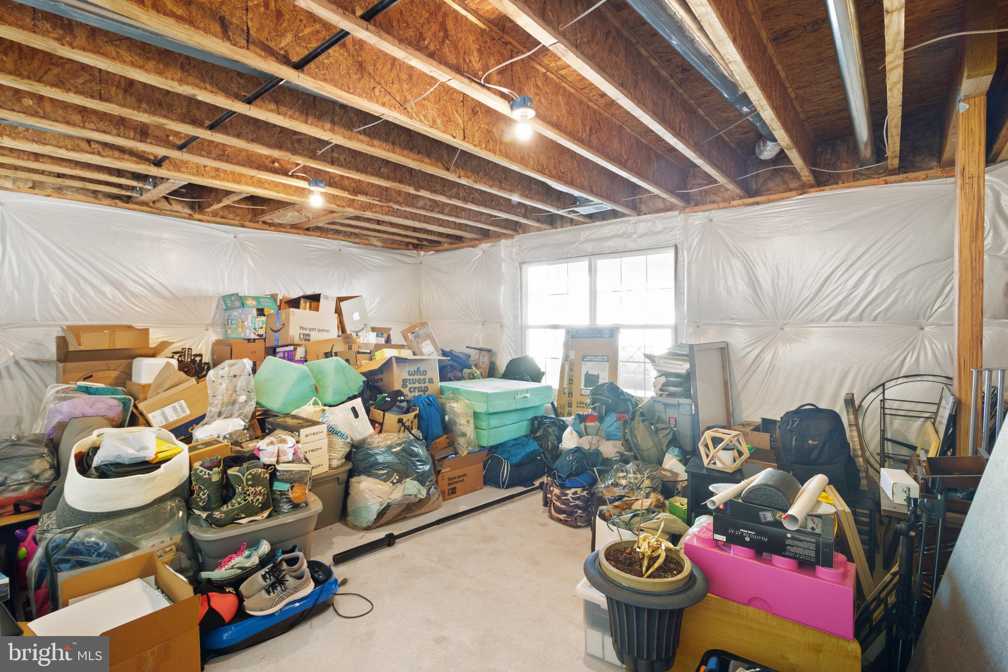 15911 Aerial View Road Woodbridge, VA 22193 - Photo 42 of 48 a room with lots of different colored cloths