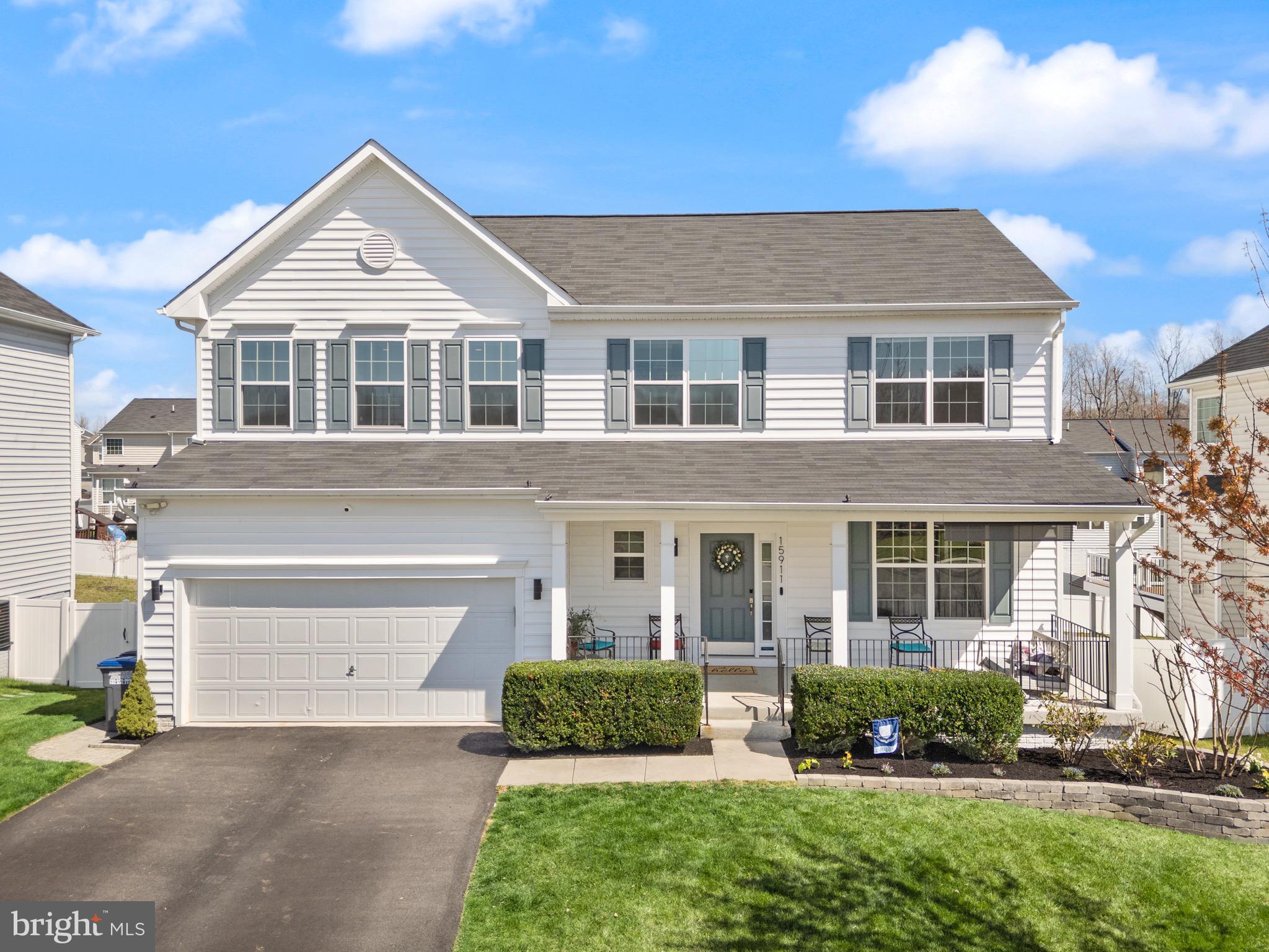 15911 Aerial View Road Woodbridge, VA 22193 - Photo 44 of 48 a front view of a house with a yard