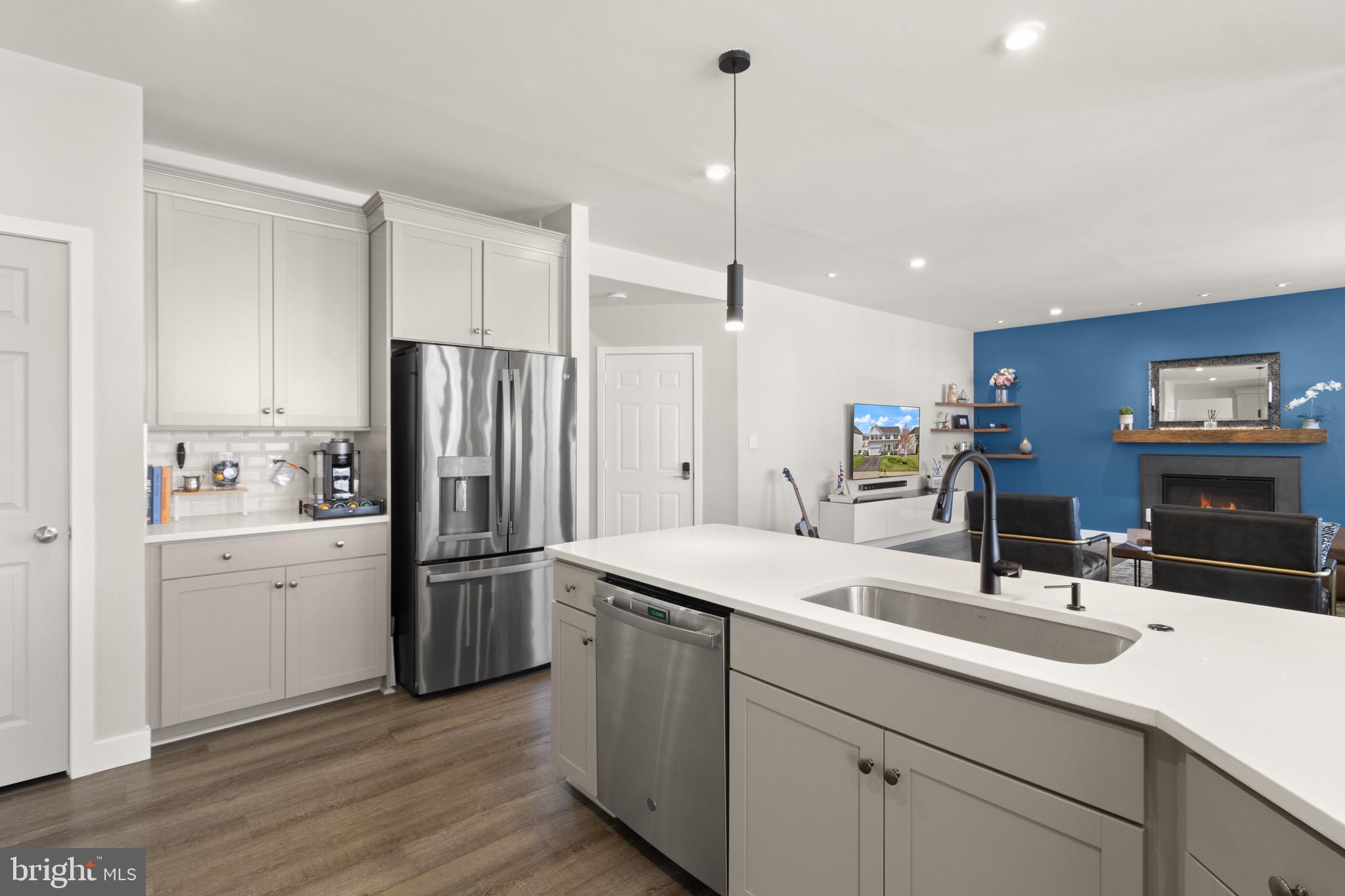 15911 Aerial View Road Woodbridge, VA 22193 - Photo 6 of 48 a kitchen with a sink stainless steel appliances and cabinets