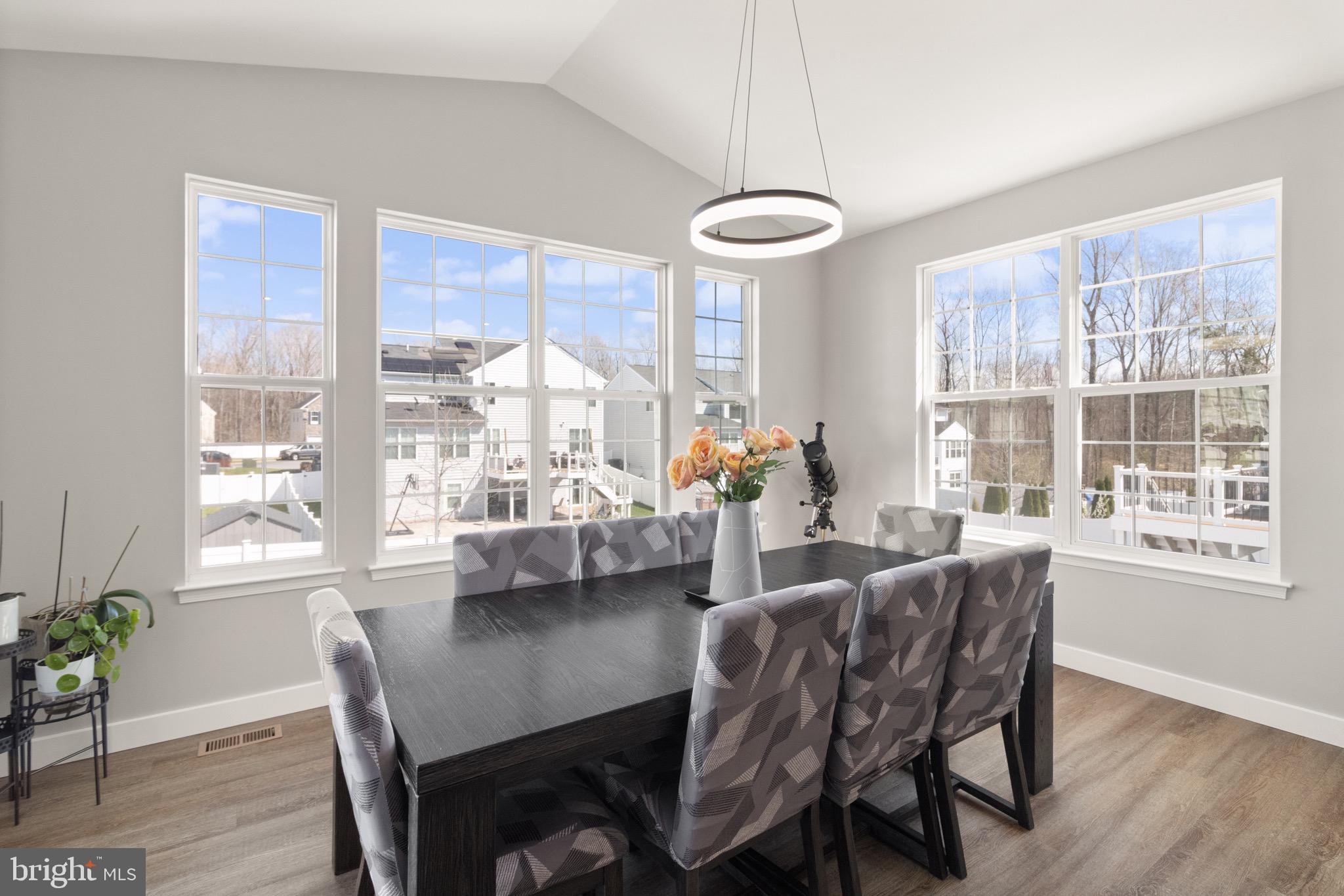 15911 Aerial View Road Woodbridge, VA 22193 - Photo 7 of 48 a view of a dining room with furniture window and wooden floor