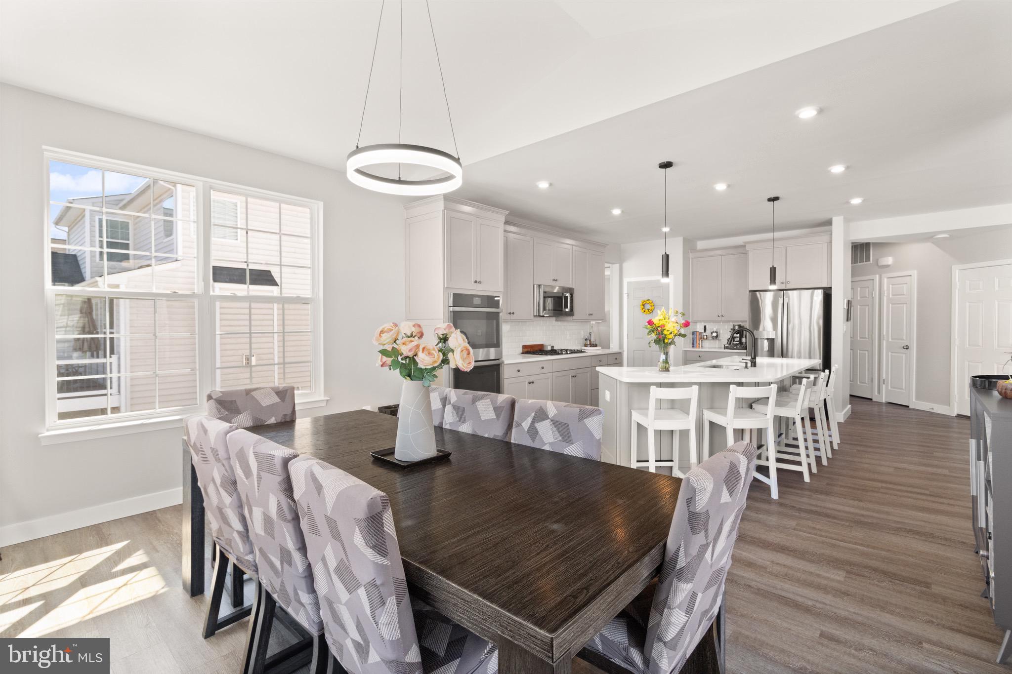 15911 Aerial View Road Woodbridge, VA 22193 - Photo 8 of 48 a dining room with furniture and wooden floor