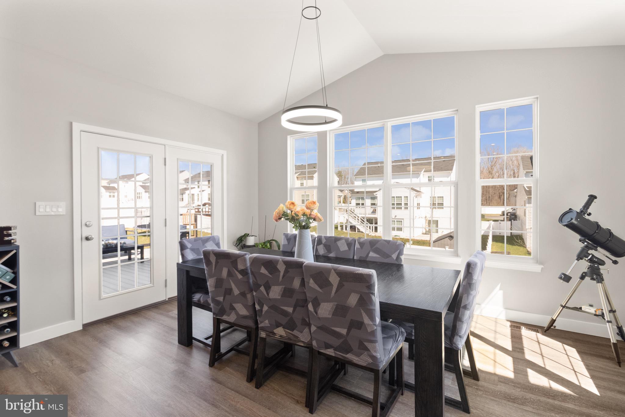 15911 Aerial View Road Woodbridge, VA 22193 - Photo 9 of 48 a view of a dining room with furniture window and wooden floor