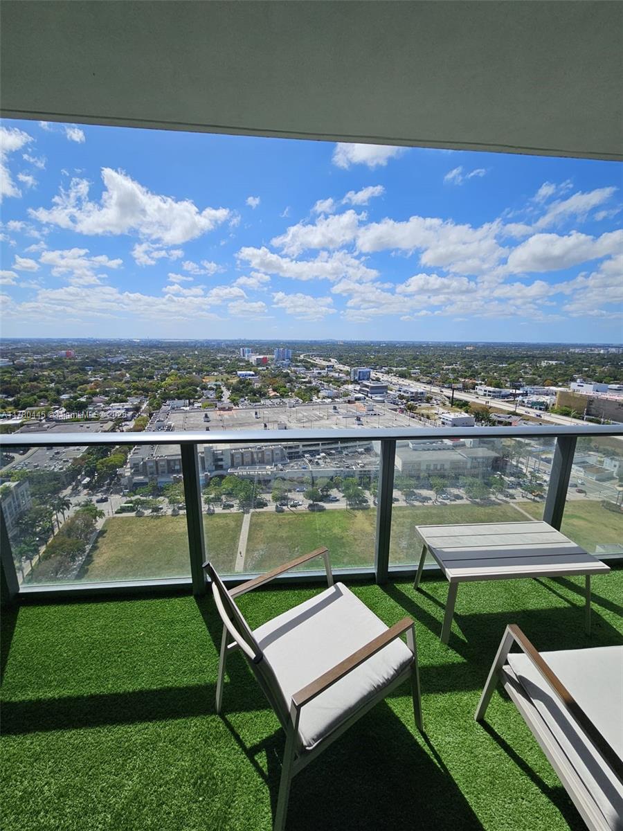 121 Northeast 34th Street, Unit 2511 Miami, FL 33137 - Photo 20 of 46 a view of a chairs in a yard