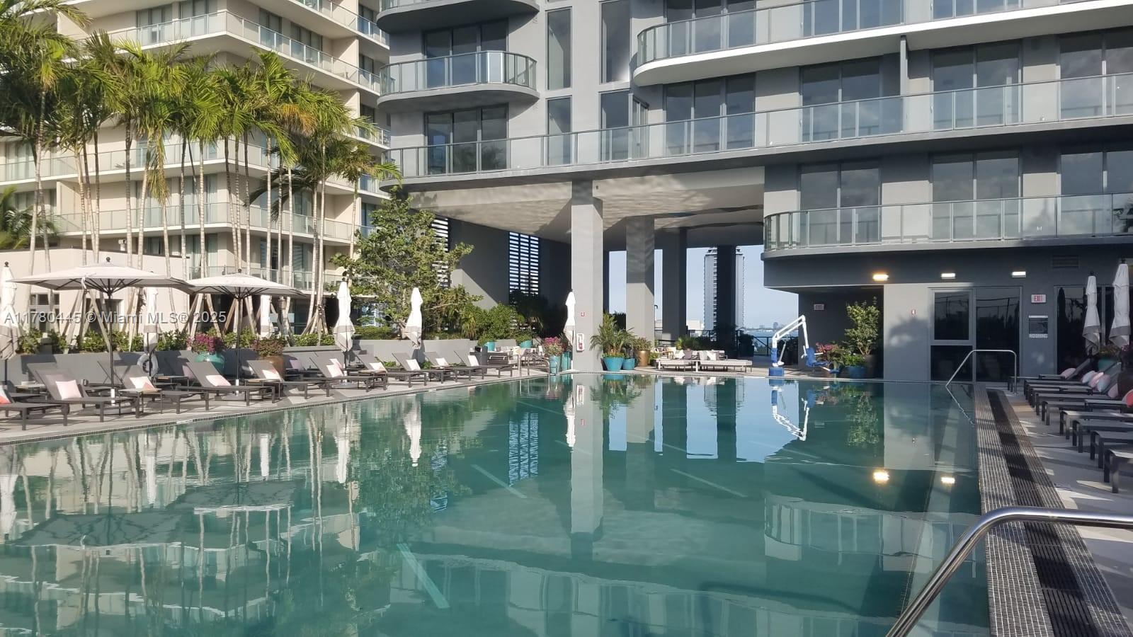 121 Northeast 34th Street, Unit 2511 Miami, FL 33137 - Photo 27 of 46 a water fountain in front of a building