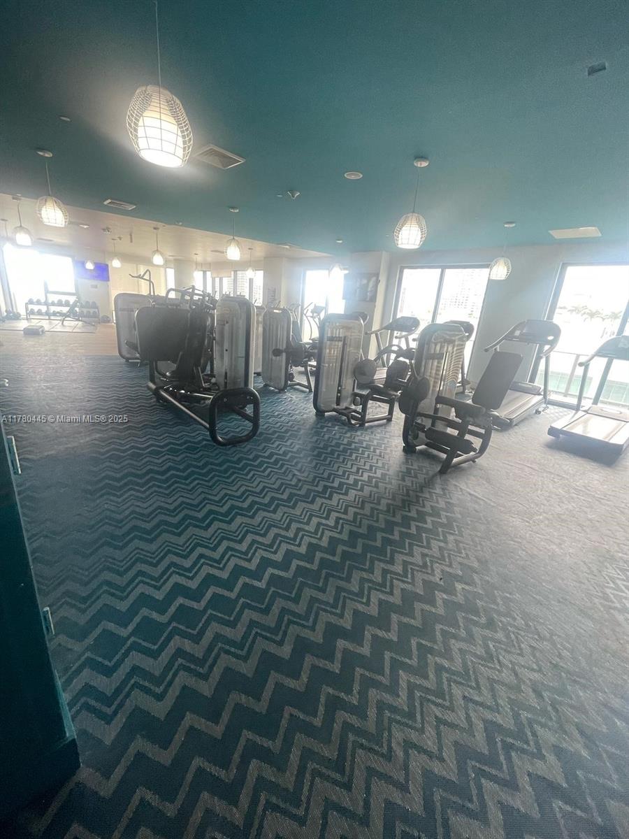 121 Northeast 34th Street, Unit 2511 Miami, FL 33137 - Photo 29 of 46 a view of a room with gym equipment
