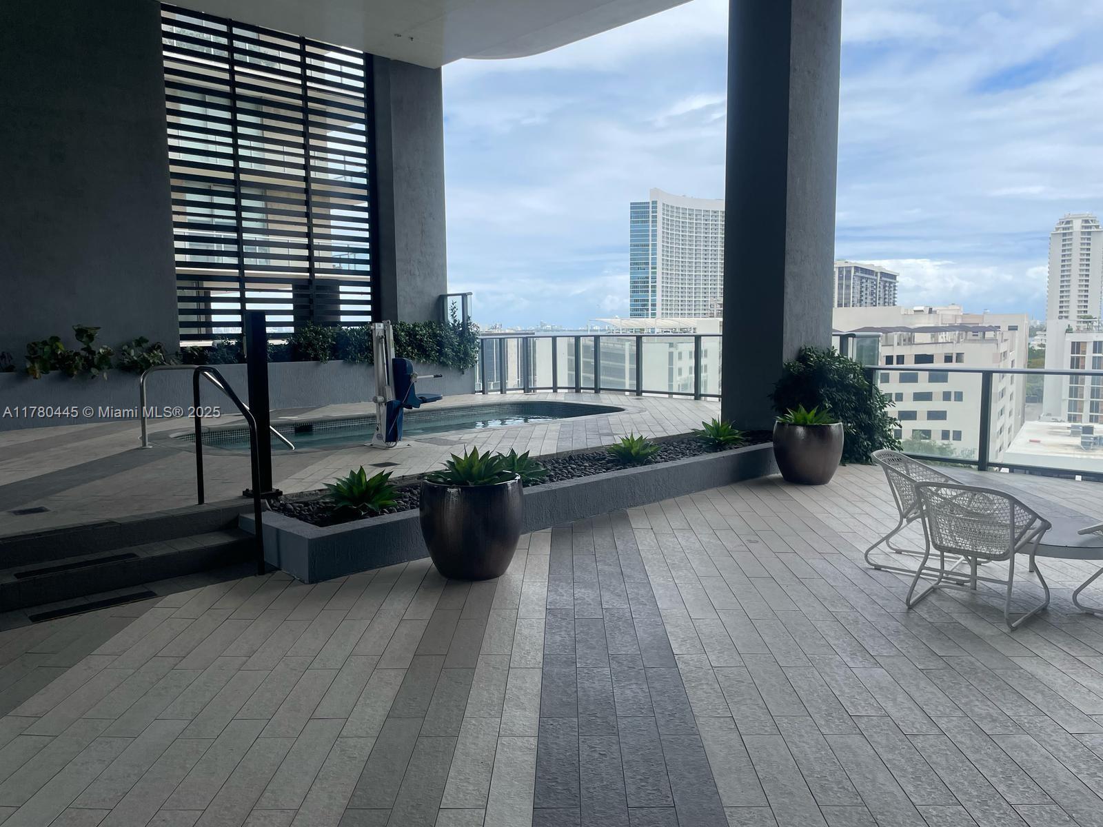 121 Northeast 34th Street, Unit 2511 Miami, FL 33137 - Photo 36 of 46 wooden floor with a bench