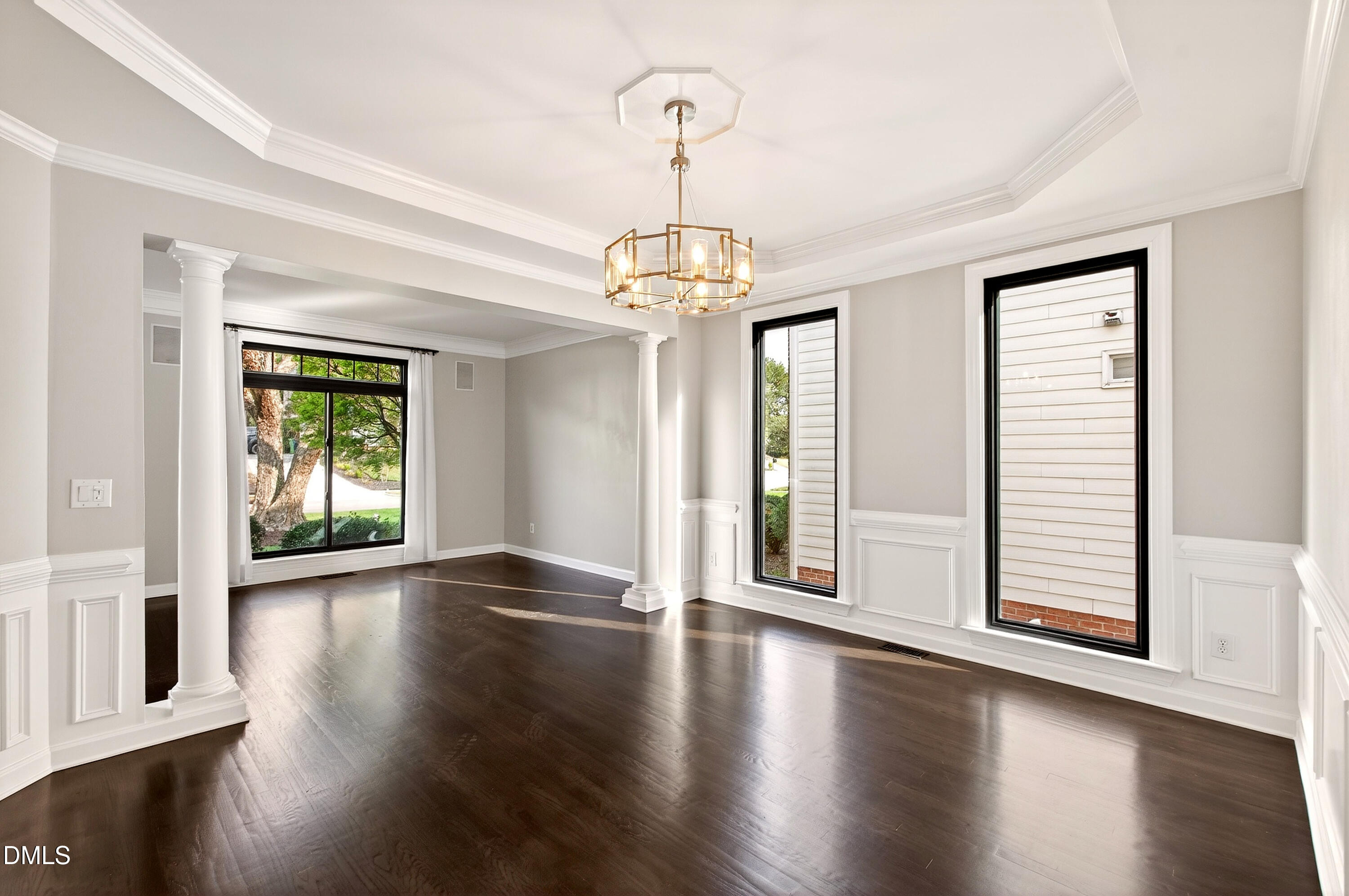 12408 Cilcain Court Raleigh, NC 27614 - Photo 12 of 80 a view of an empty room with wooden floor and a window