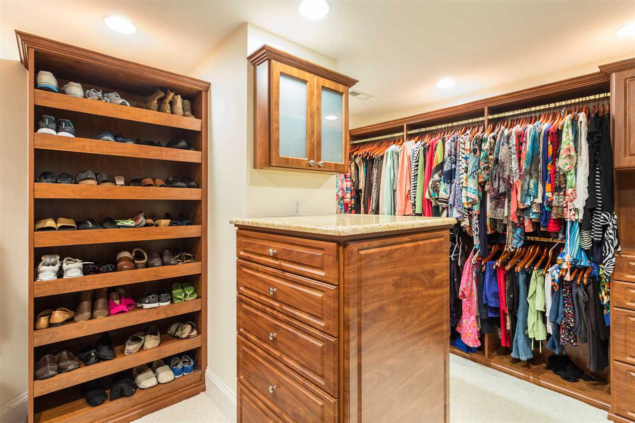 1001 Clingmans Place Raleigh, NC 27614 - Photo 24 of 30 The closet is divided into 2 sections that feel like a rooms. This section has a built in lingerie chest with granite countertop. It adjoins Bedroom 4. Spoil Yourself ( and your Clothes) with a Luxurious Closet